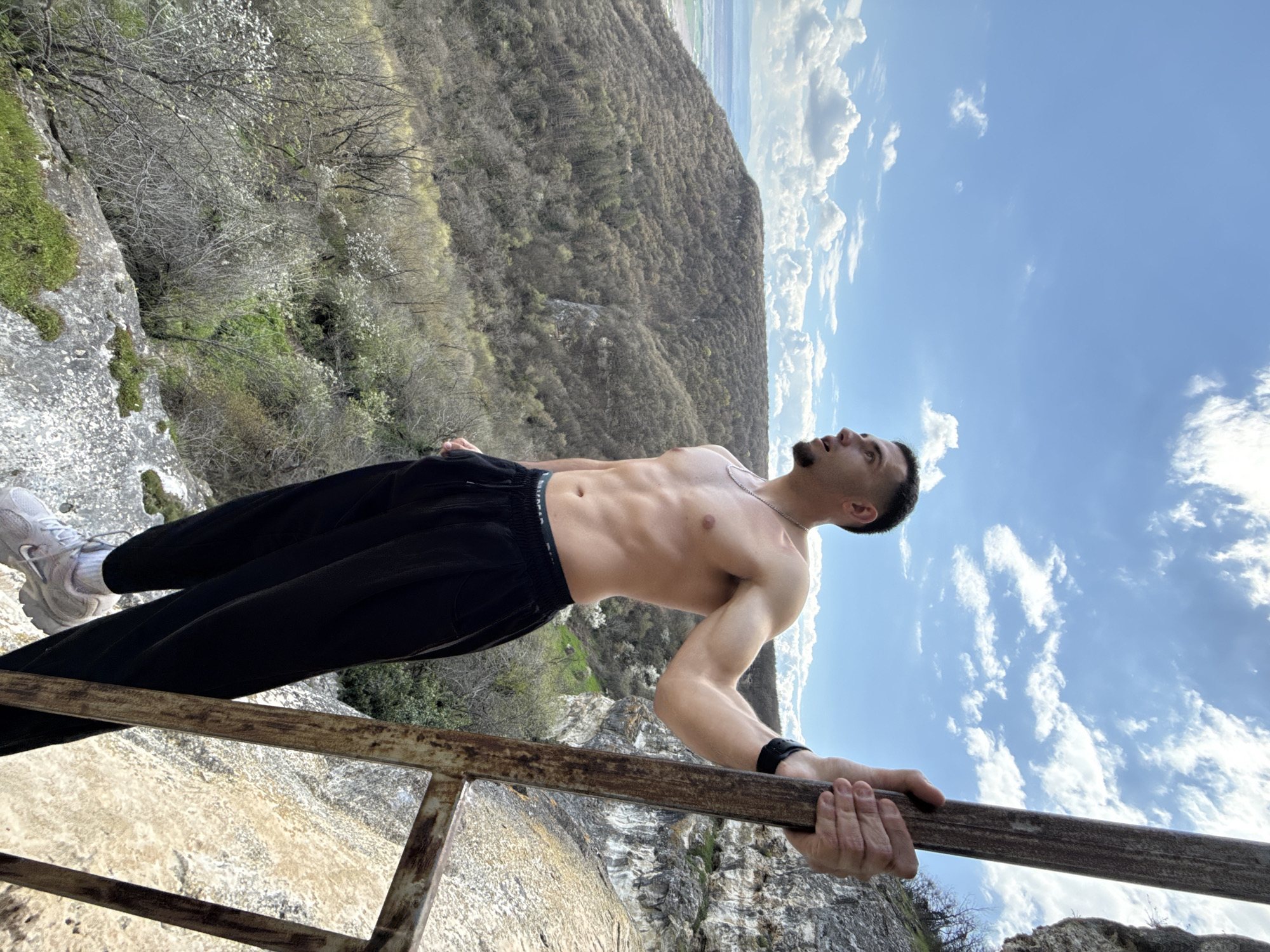 Man performs calisthenics exercise at high altitude in Shumen
