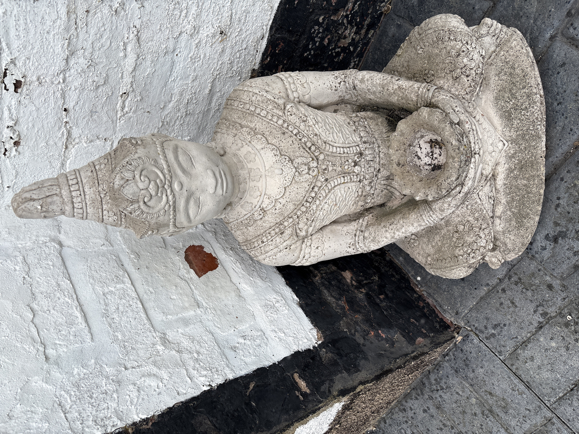 Stone Buddha statue spotted outdoors in Minsterley, UK