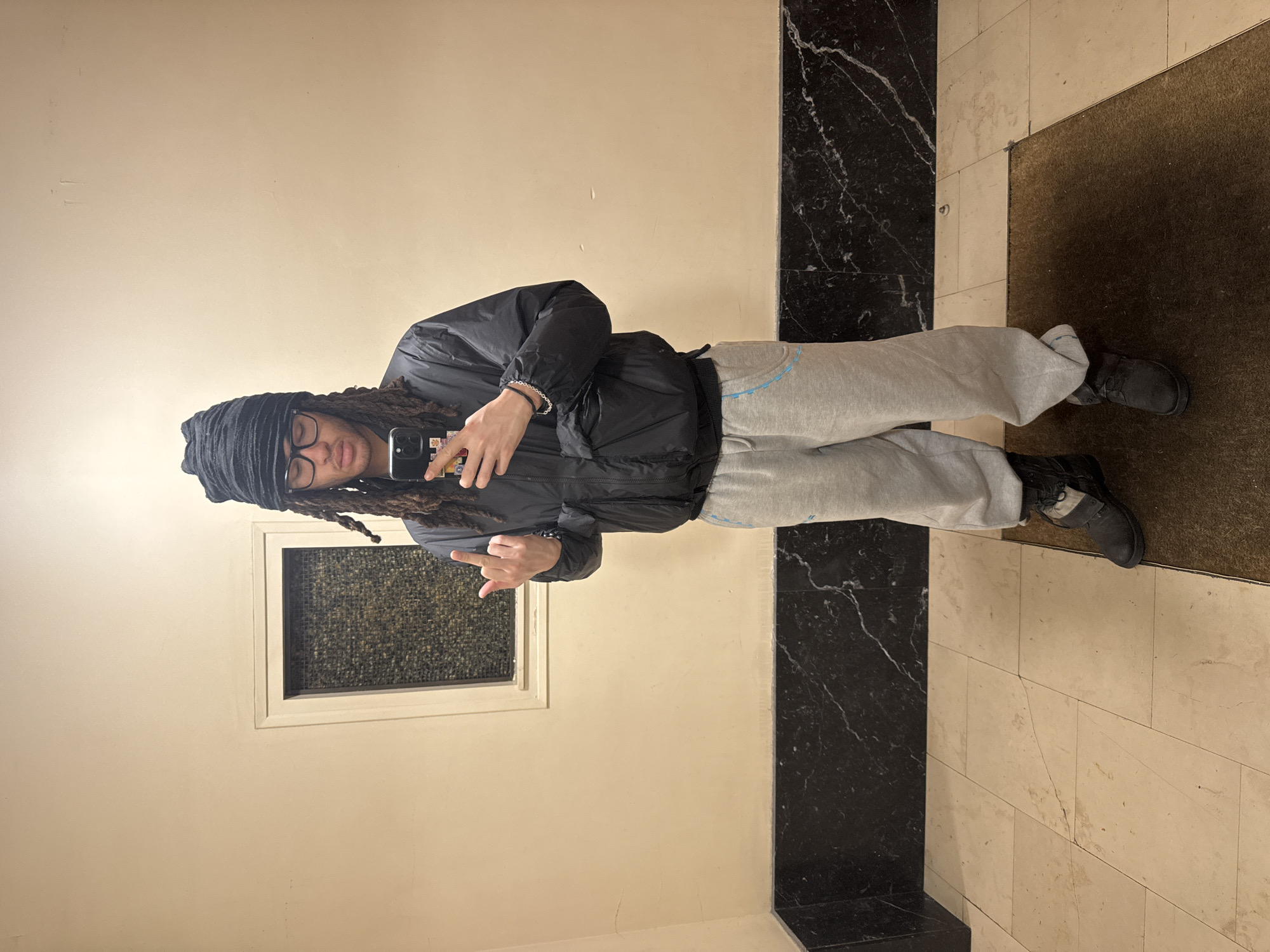 Person takes indoor selfie in Paris building