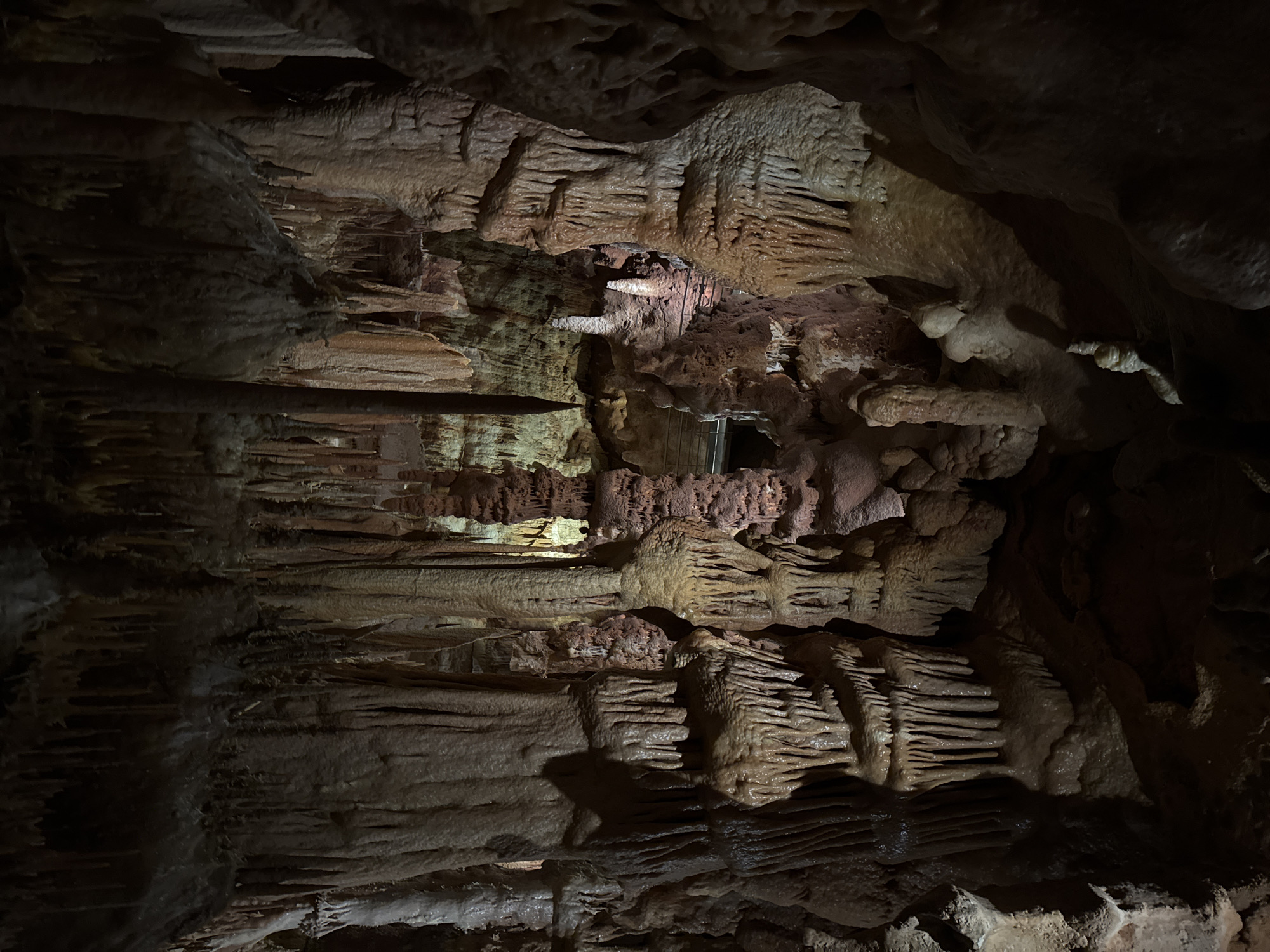 Visitors document limestone formations inside Petralona Cave, Greece