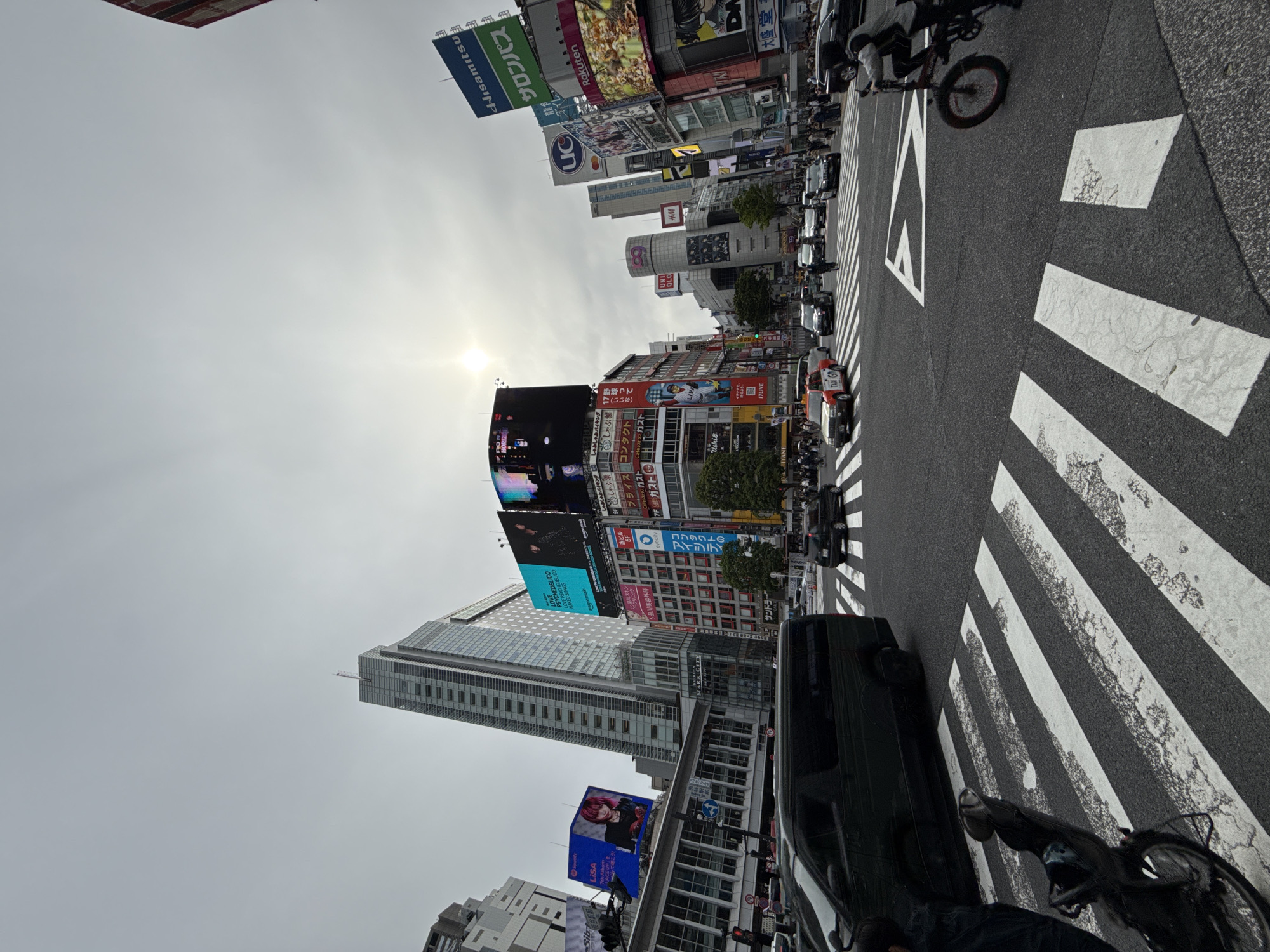 Morning crowds gather at sunny Shibuya Crossing, Tokyo