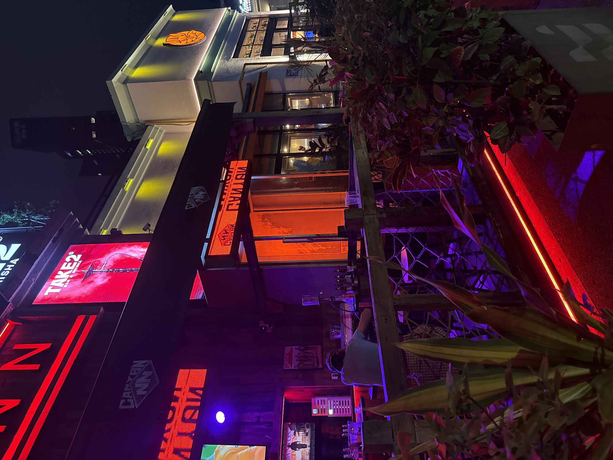 Evening street life captured in Tianhe District commercial area