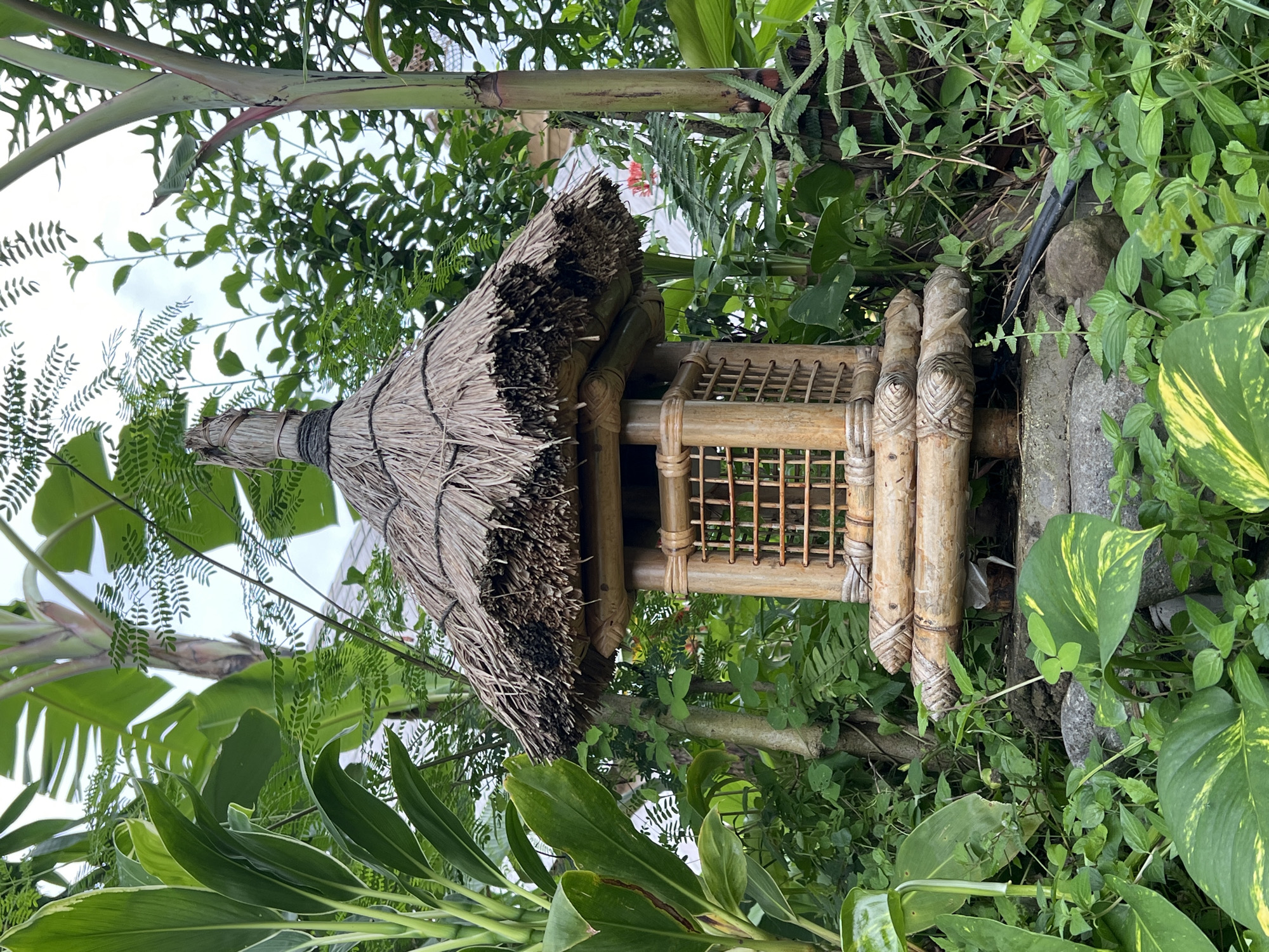 Tourist documents traditional Balinese property features in Ubud