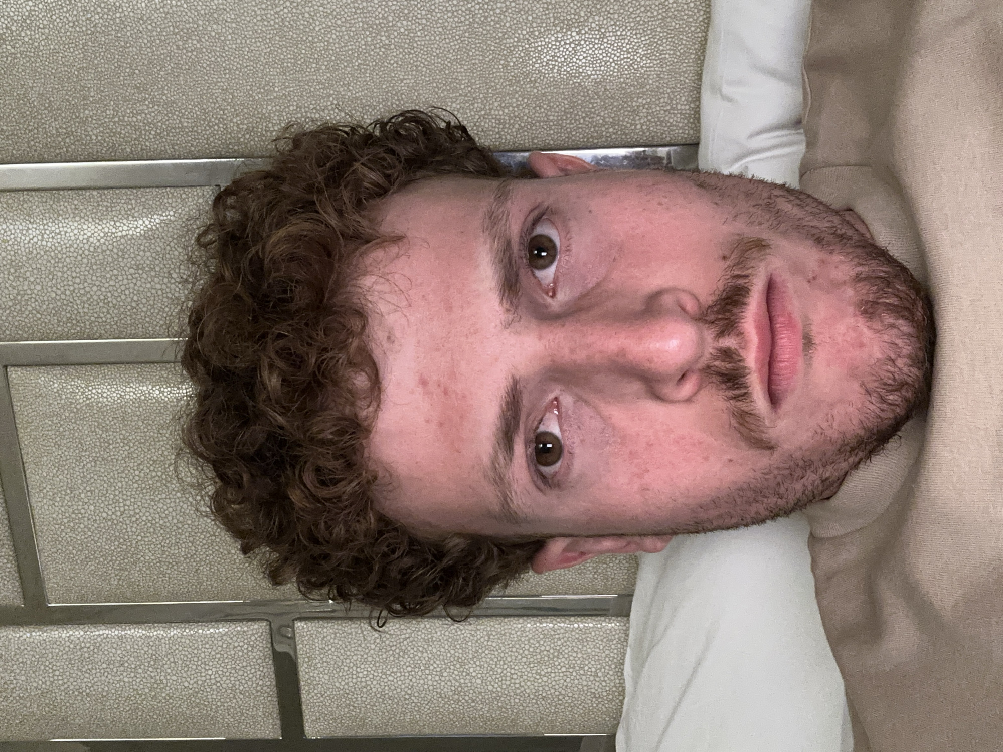 Person documented in bedroom setting in Aventura, Florida