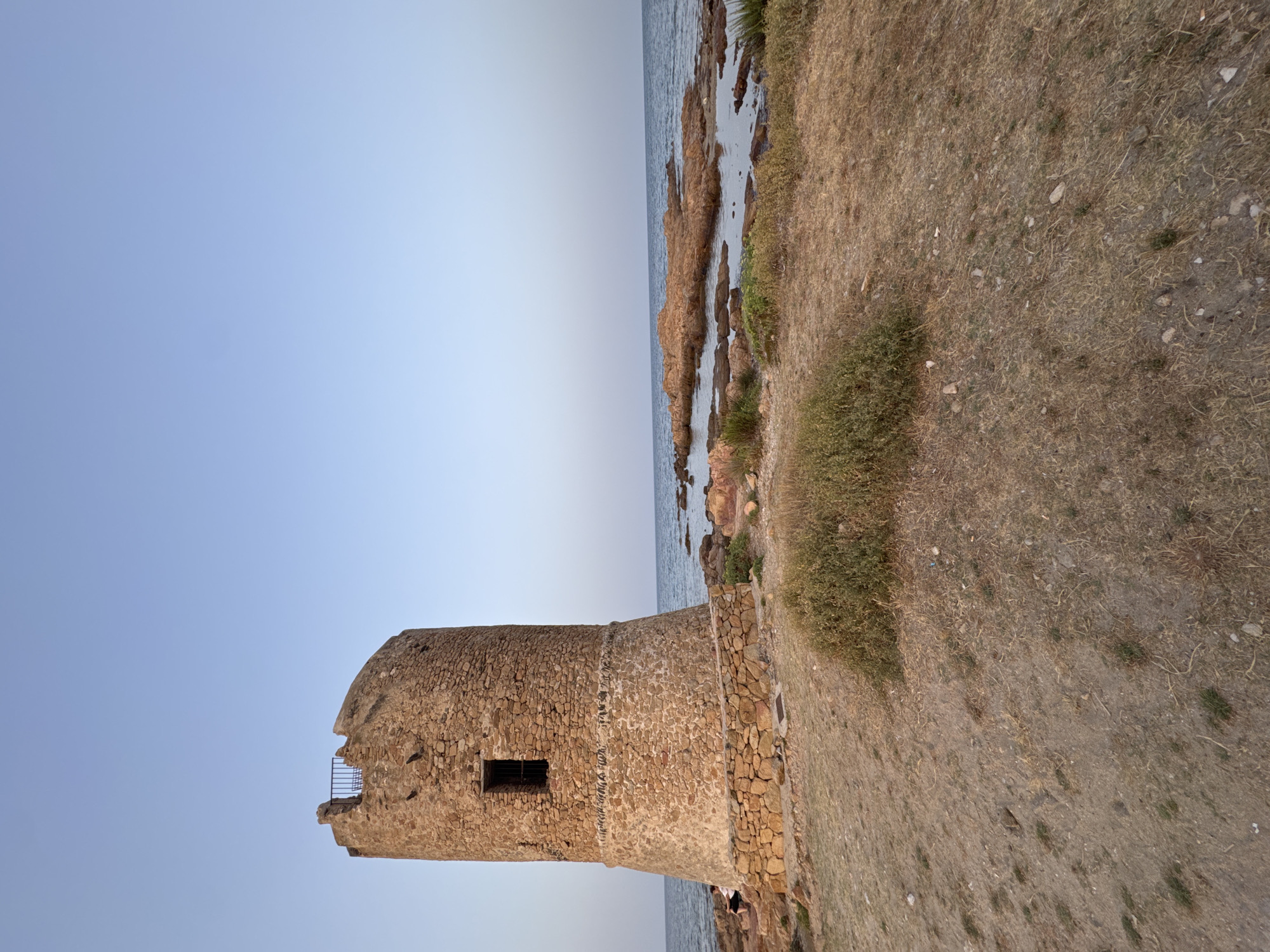 Medieval coastal tower at dusk, San Giovanni, Italy