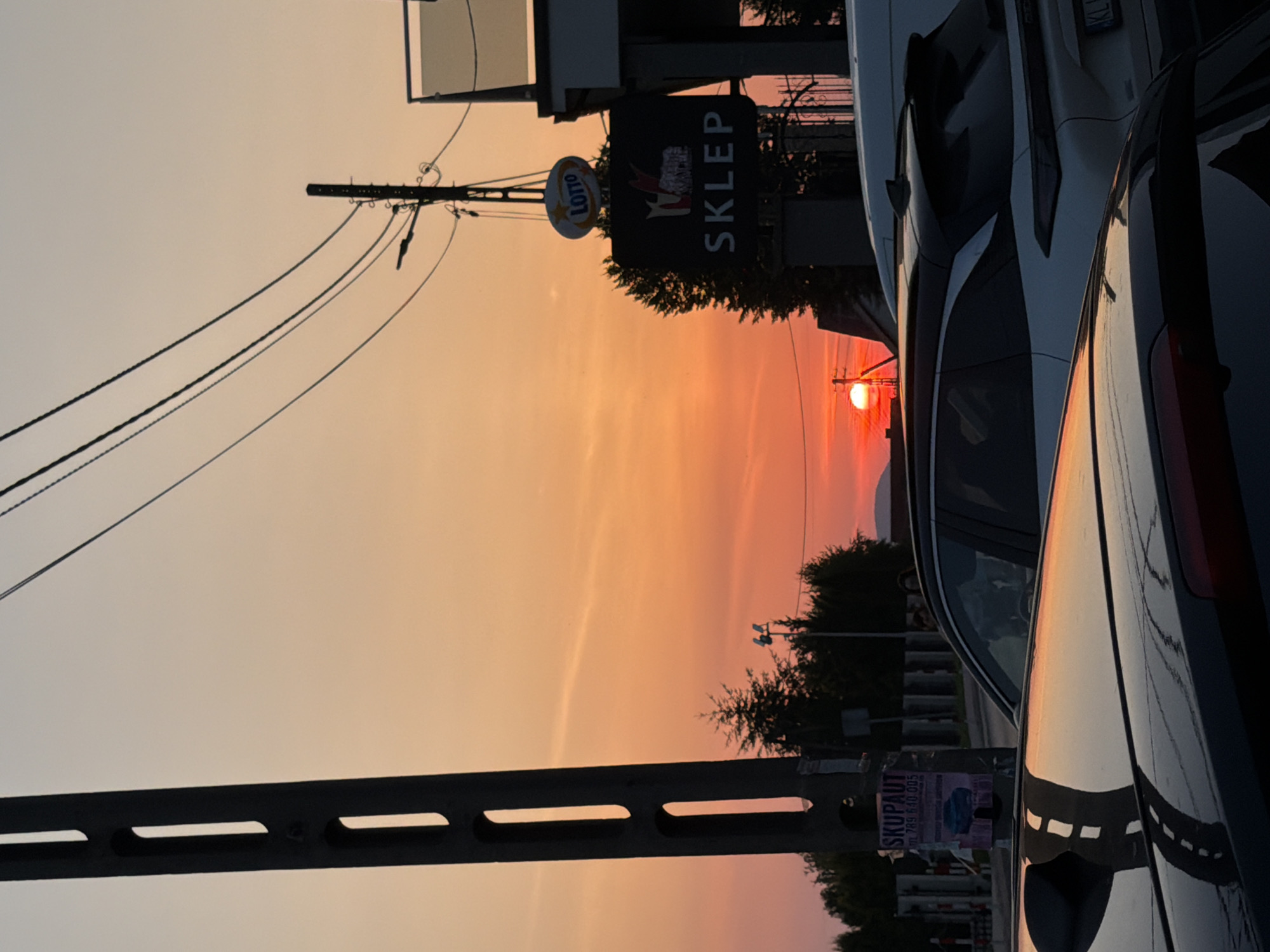Sunset light over a quiet street in Mordarka, Poland