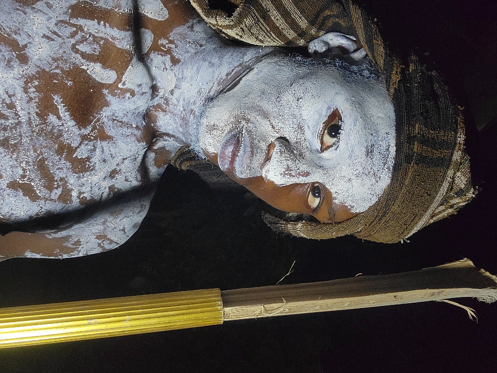 Traditional ceremony with white body paint documented in Onitsha