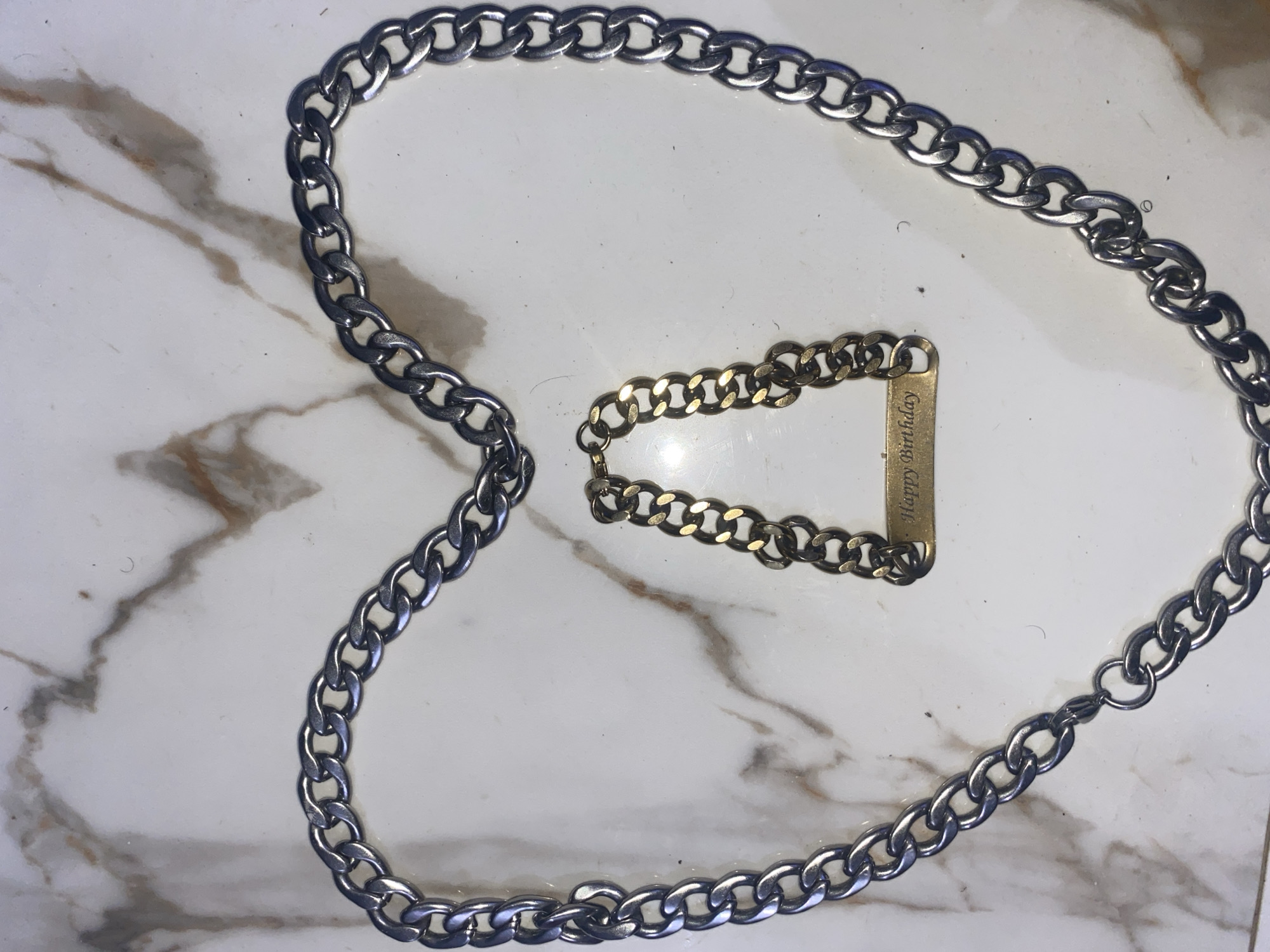 Person arranges birthday jewelry with powdered hands in Ghana