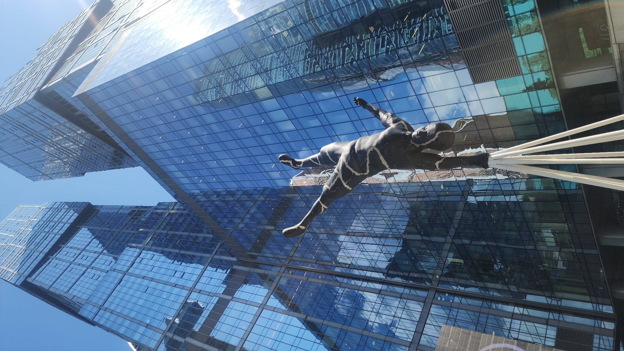Morning at Moscow City's towers, sculptures, and parked motorcycles