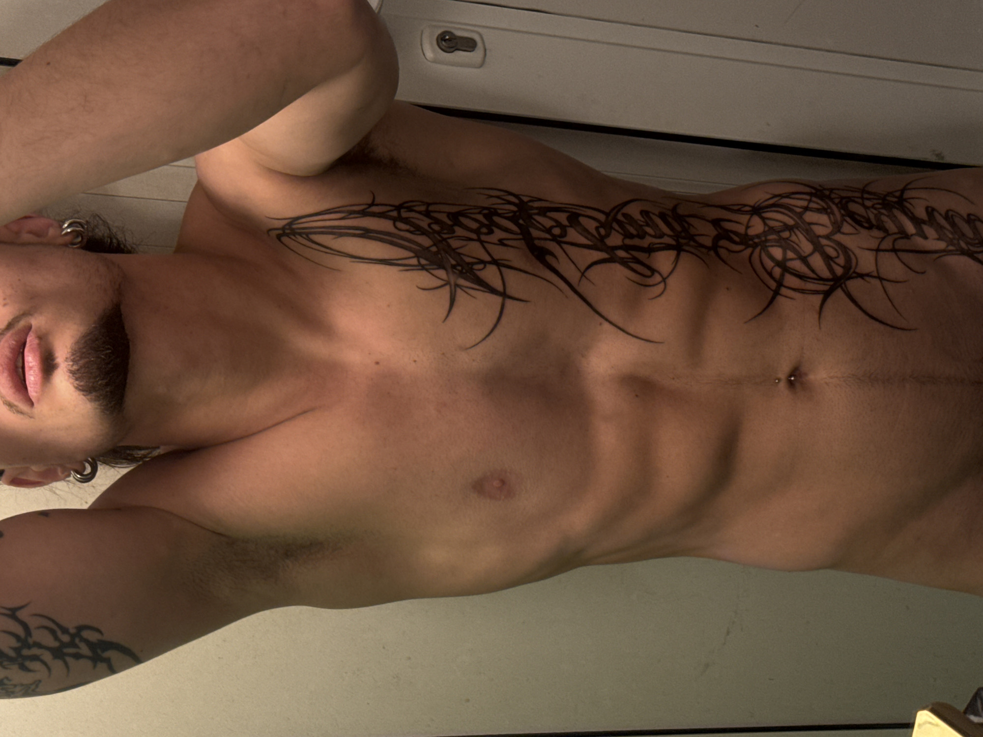 Mirror selfies showing tattoos and physique, Sofia indoors