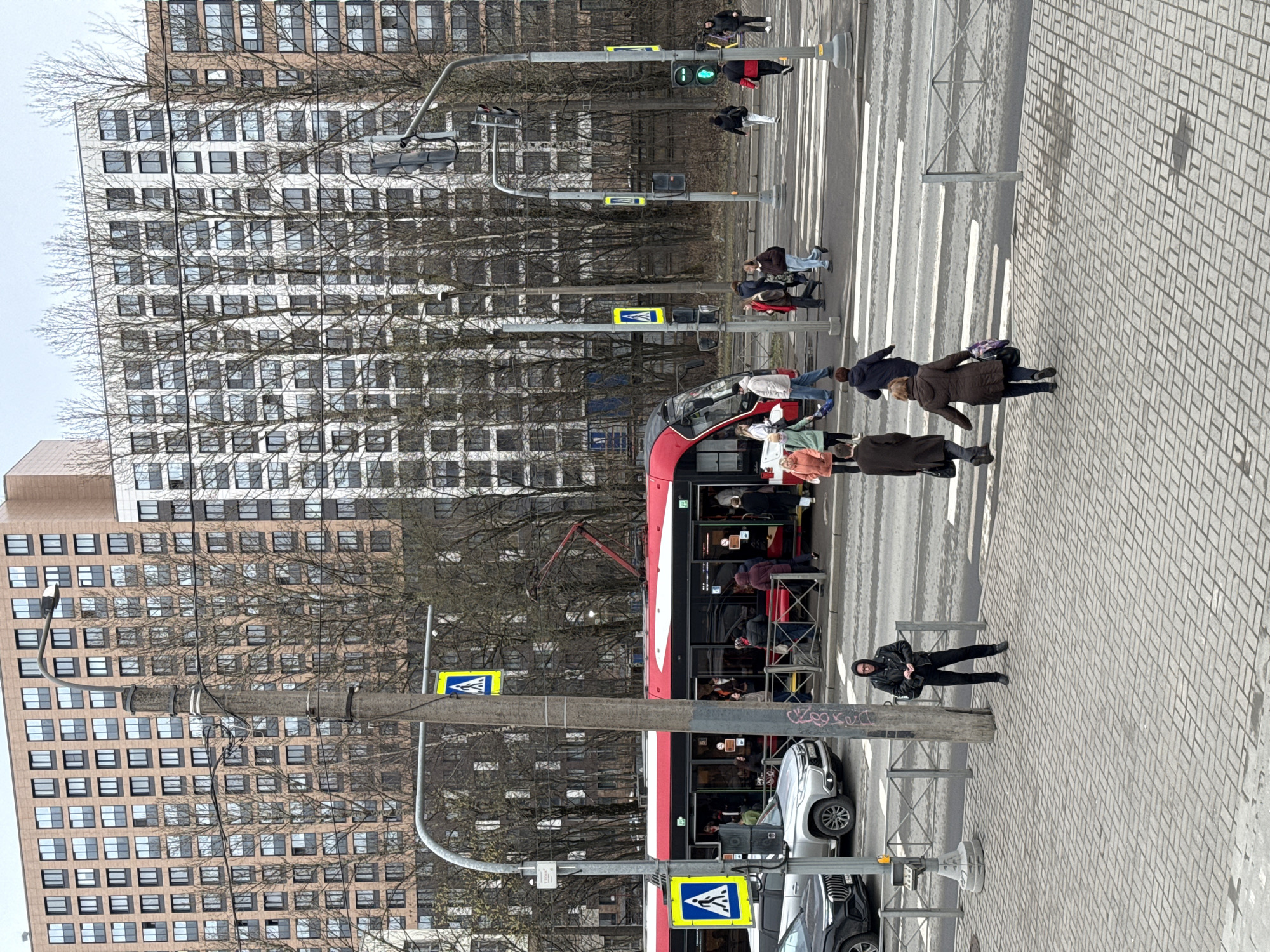 Tram navigates pedestrian crossing in Saint Petersburg morning commute
