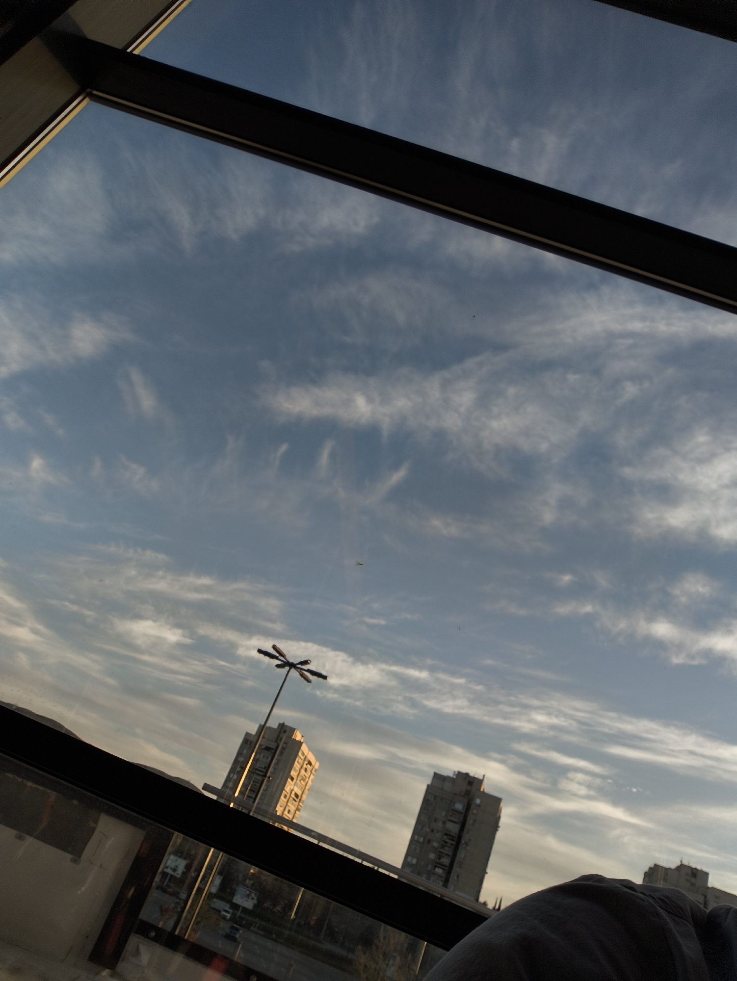 Window view captures cloudy afternoon scene in Stara Zagora
