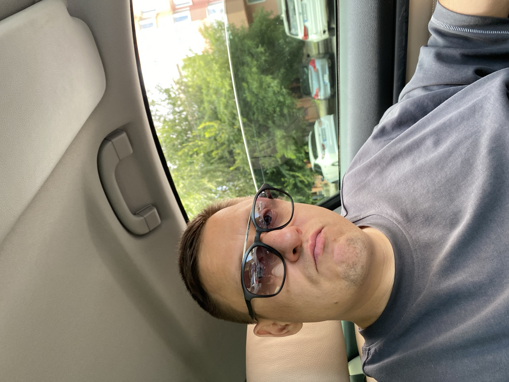 Selfies and street views from inside a city car ride