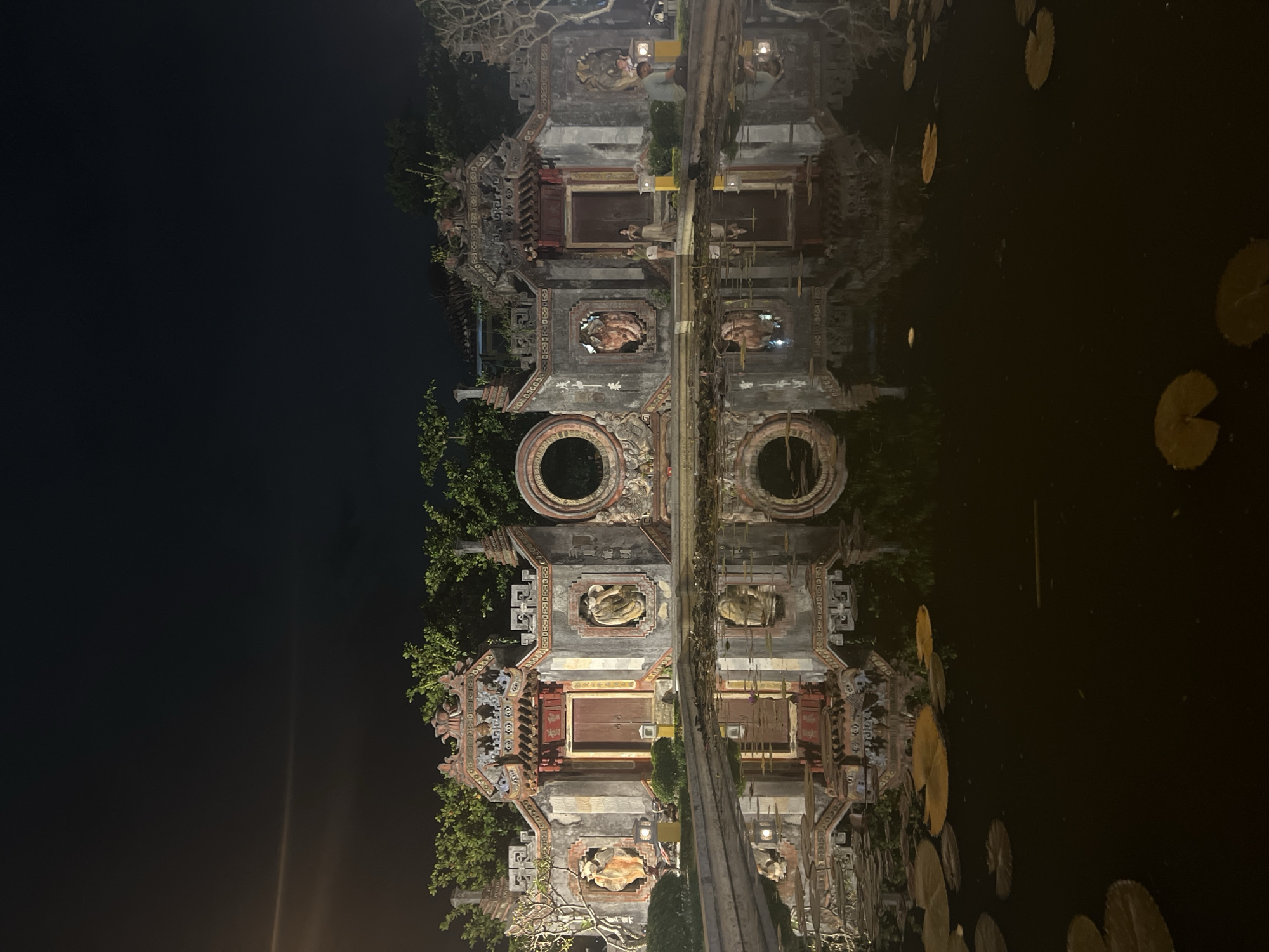 Hoi An at night: lanterns, street performance, and temple architecture