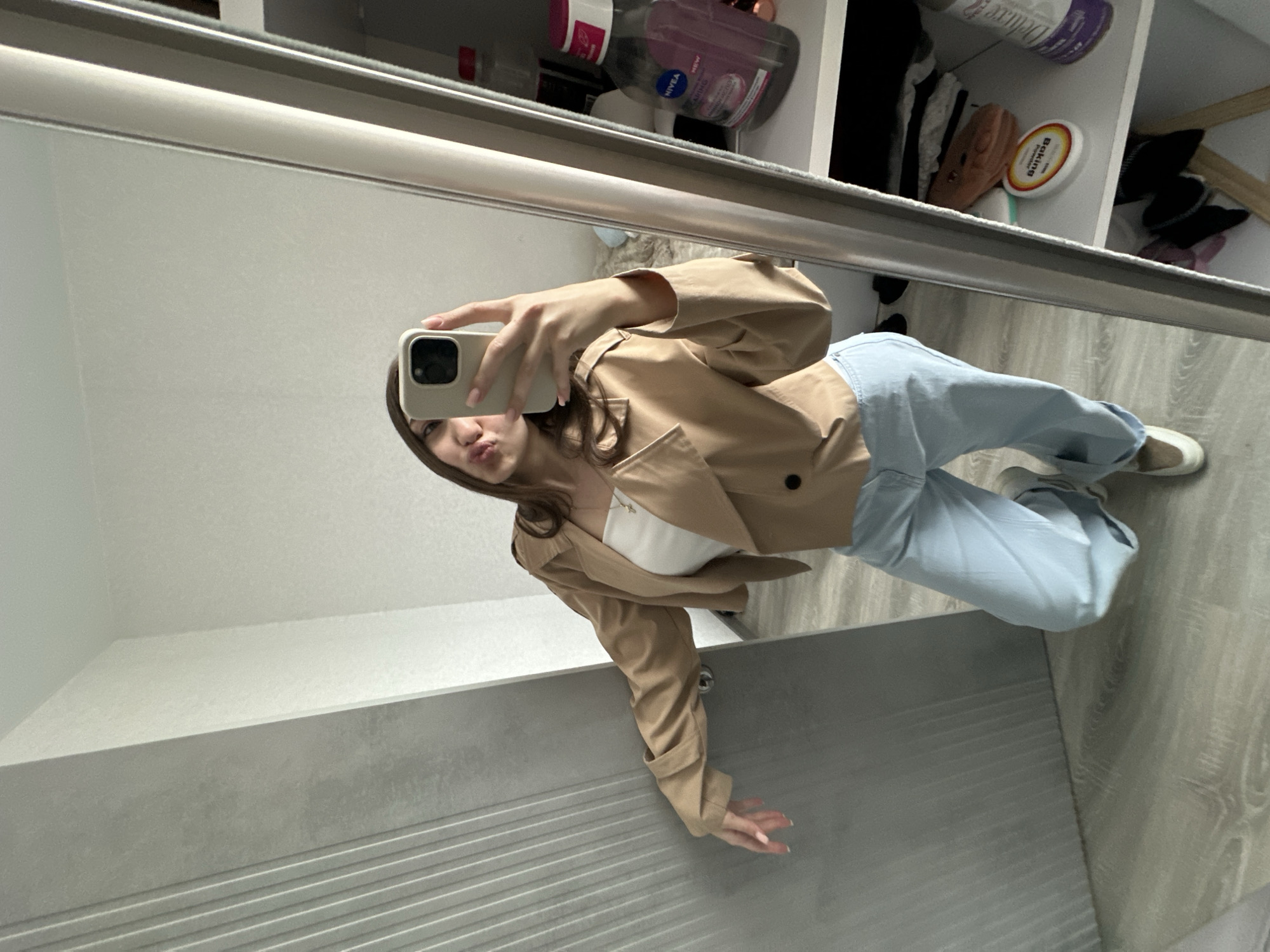 Woman takes mirror selfie in Yerevan early morning