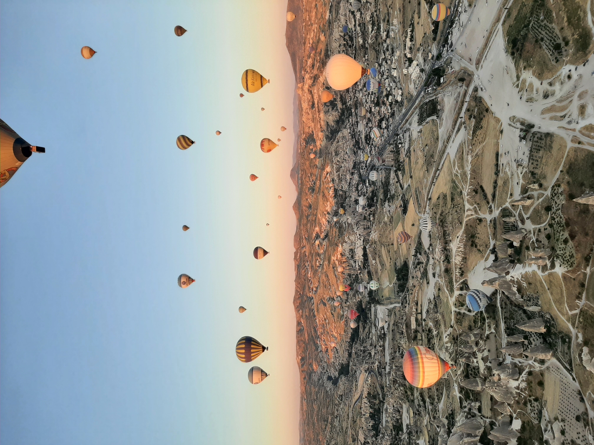 Hot air balloons drift over Göreme's iconic Cappadocia landscape