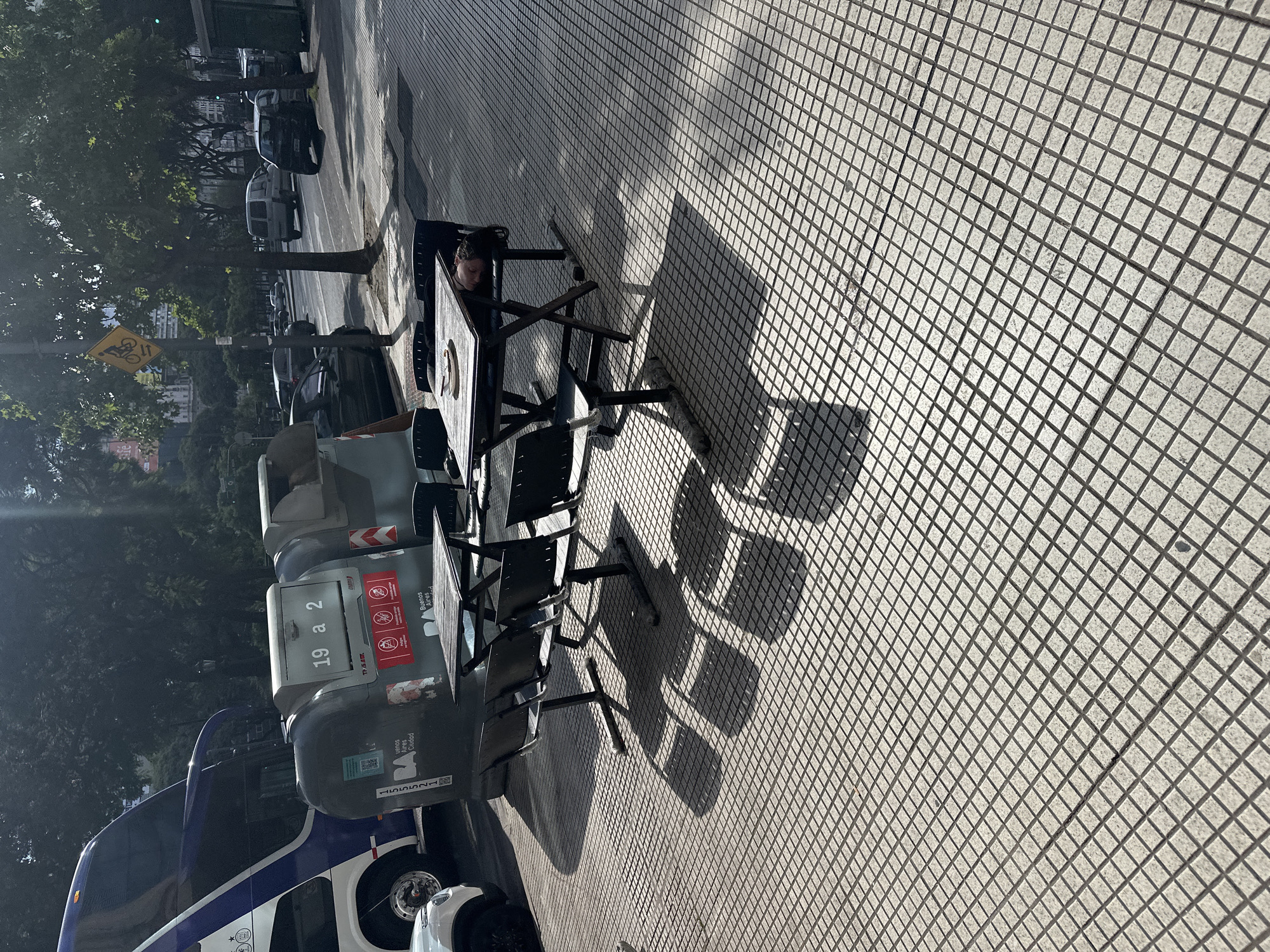 Outdoor cafe scene observed on Buenos Aires sidewalk
