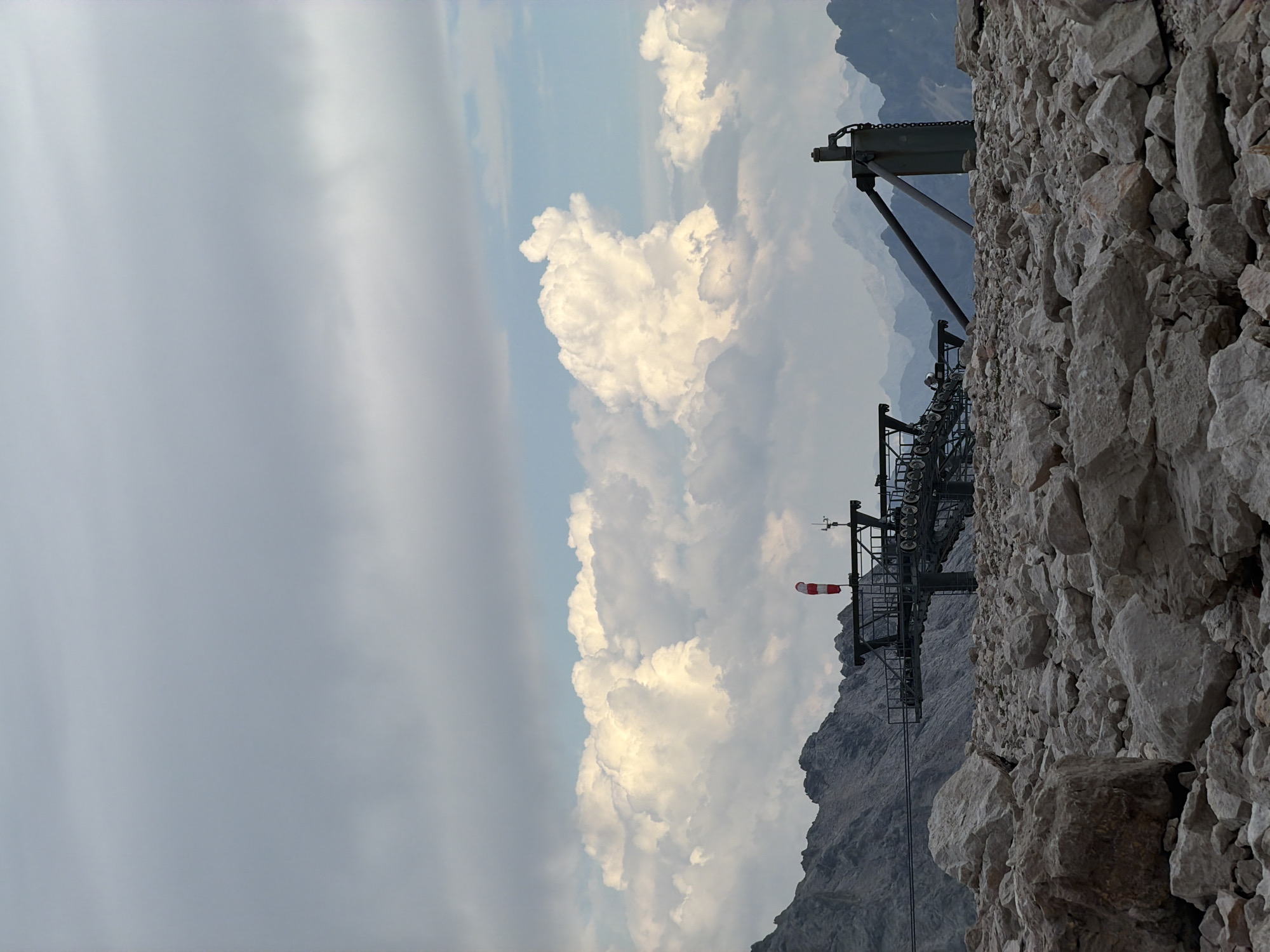 Ski lift and rocky alpine terrain under cloudy skies, Garmisch-Partenkirchen