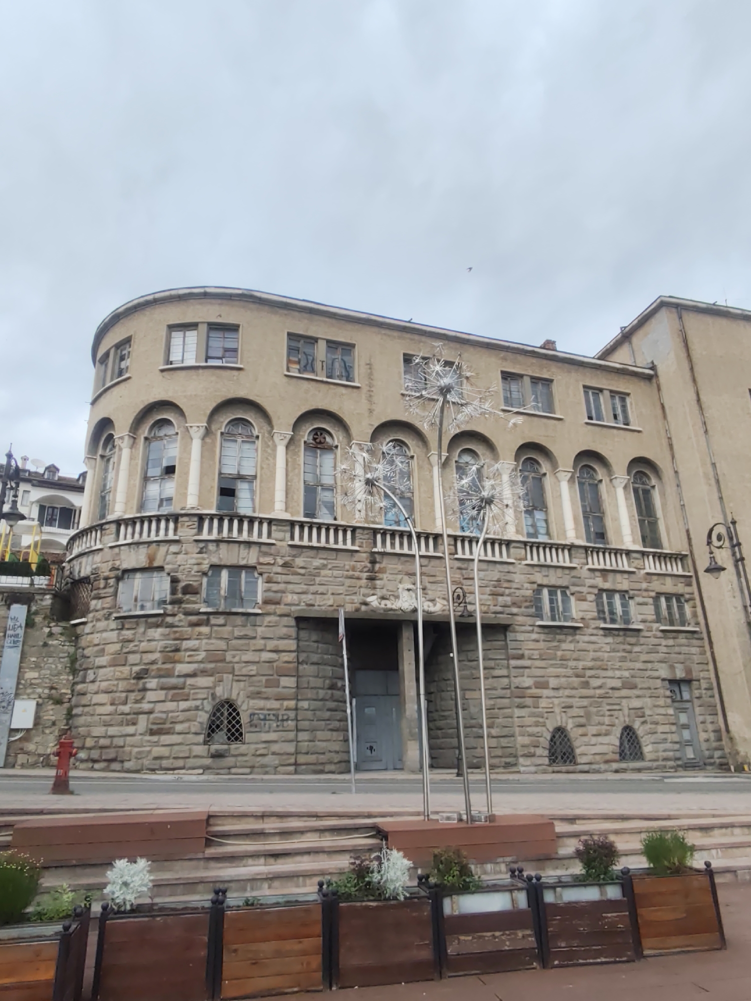 Tourist documents historic Veliko Tarnovo during brief afternoon walk