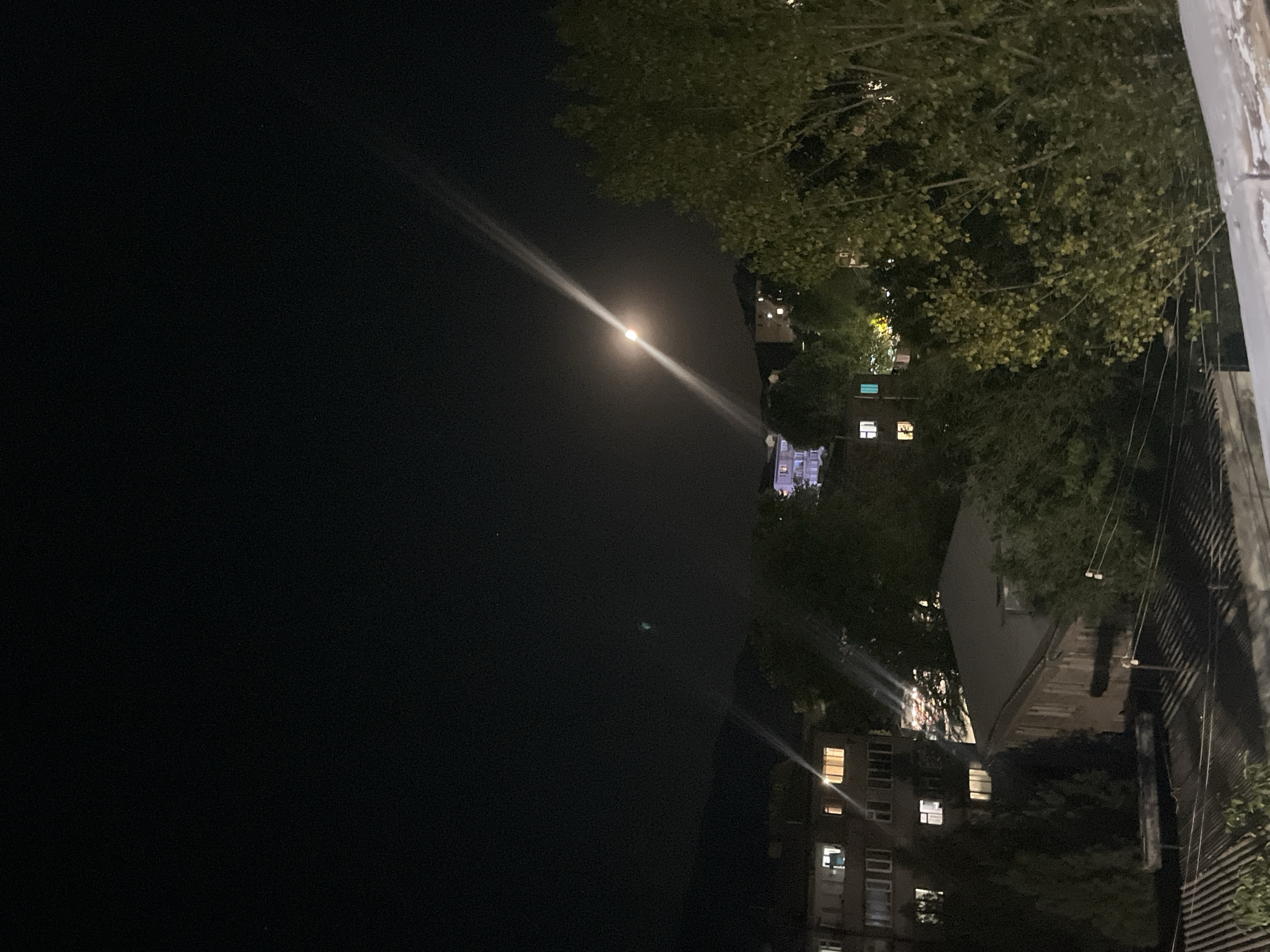 Nighttime scenes around Gladzor apartment buildings, moon overhead