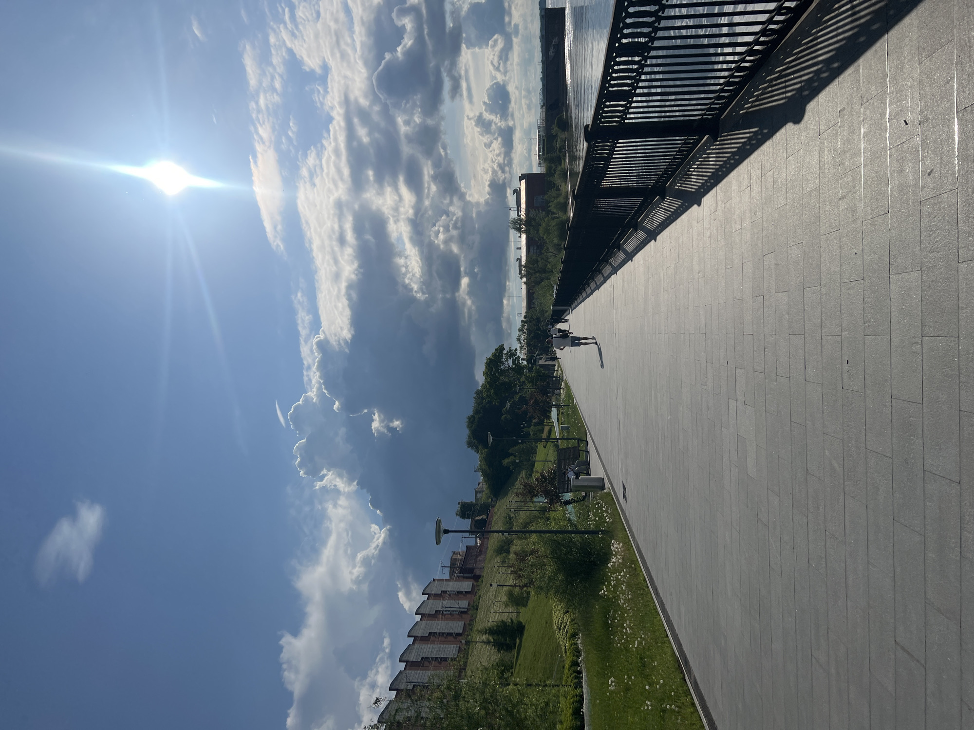 Witness documents Perm Embankment along Kama River under cloudy skies