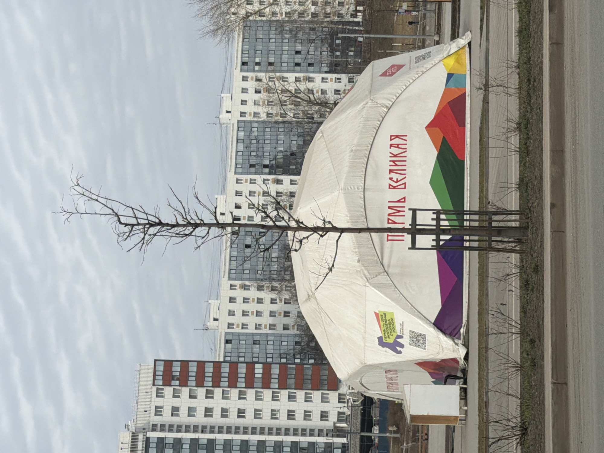 Morning street life documented around Tatishchev statue in Perm