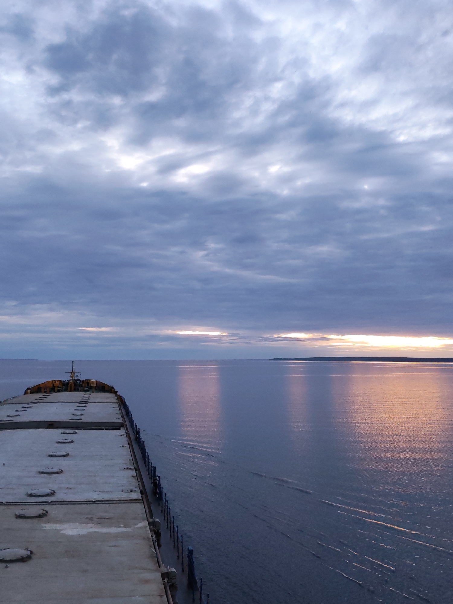 Cargo ship navigates Russian waters at sunrise