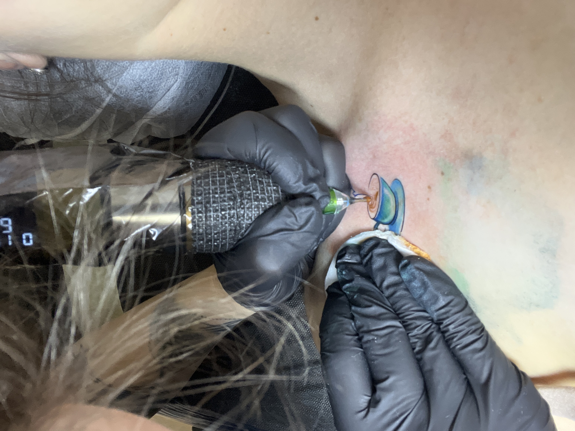 Woman gets teacup tattoo in Podgorica Montenegro parlor