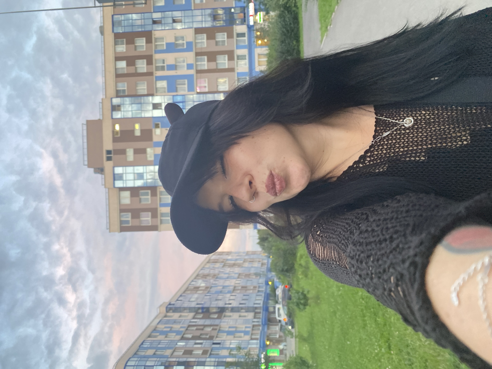 Selfies outside modern apartments in Yanino-1, Russia