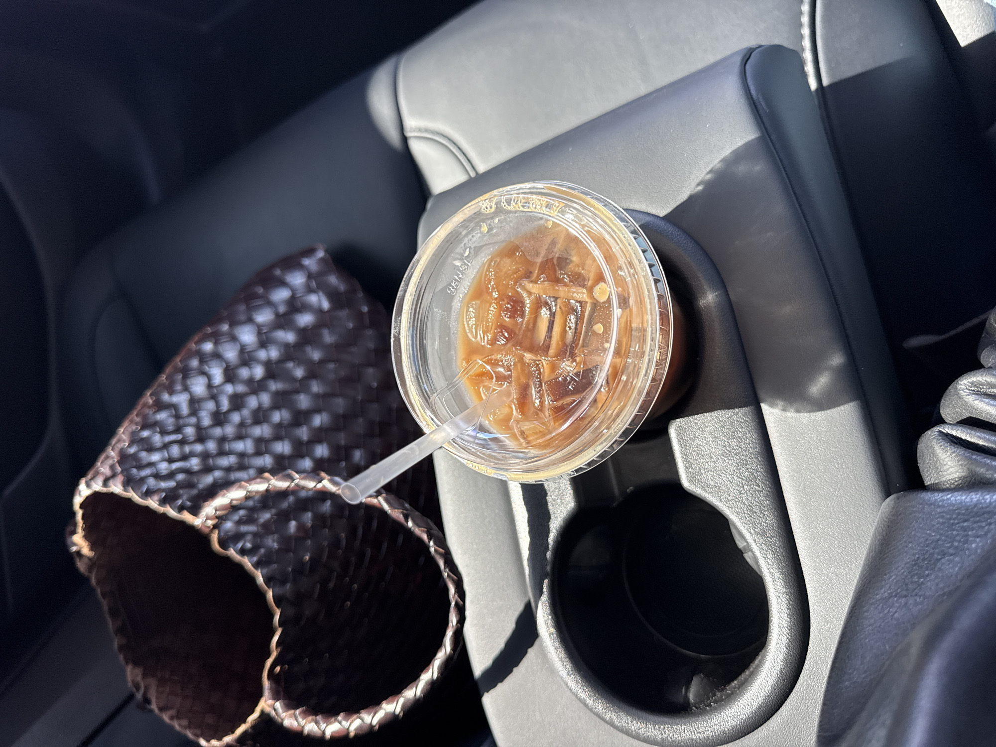 Vehicle interior with iced coffee documented in Los Angeles