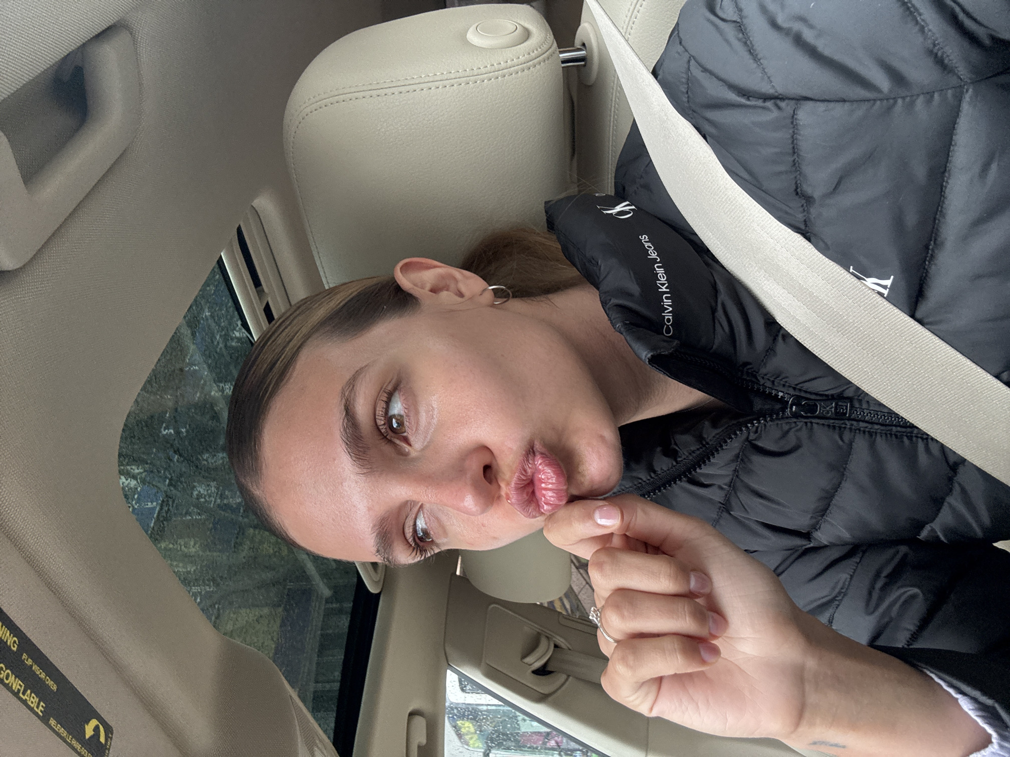 Woman takes car selfies in Tbilisi