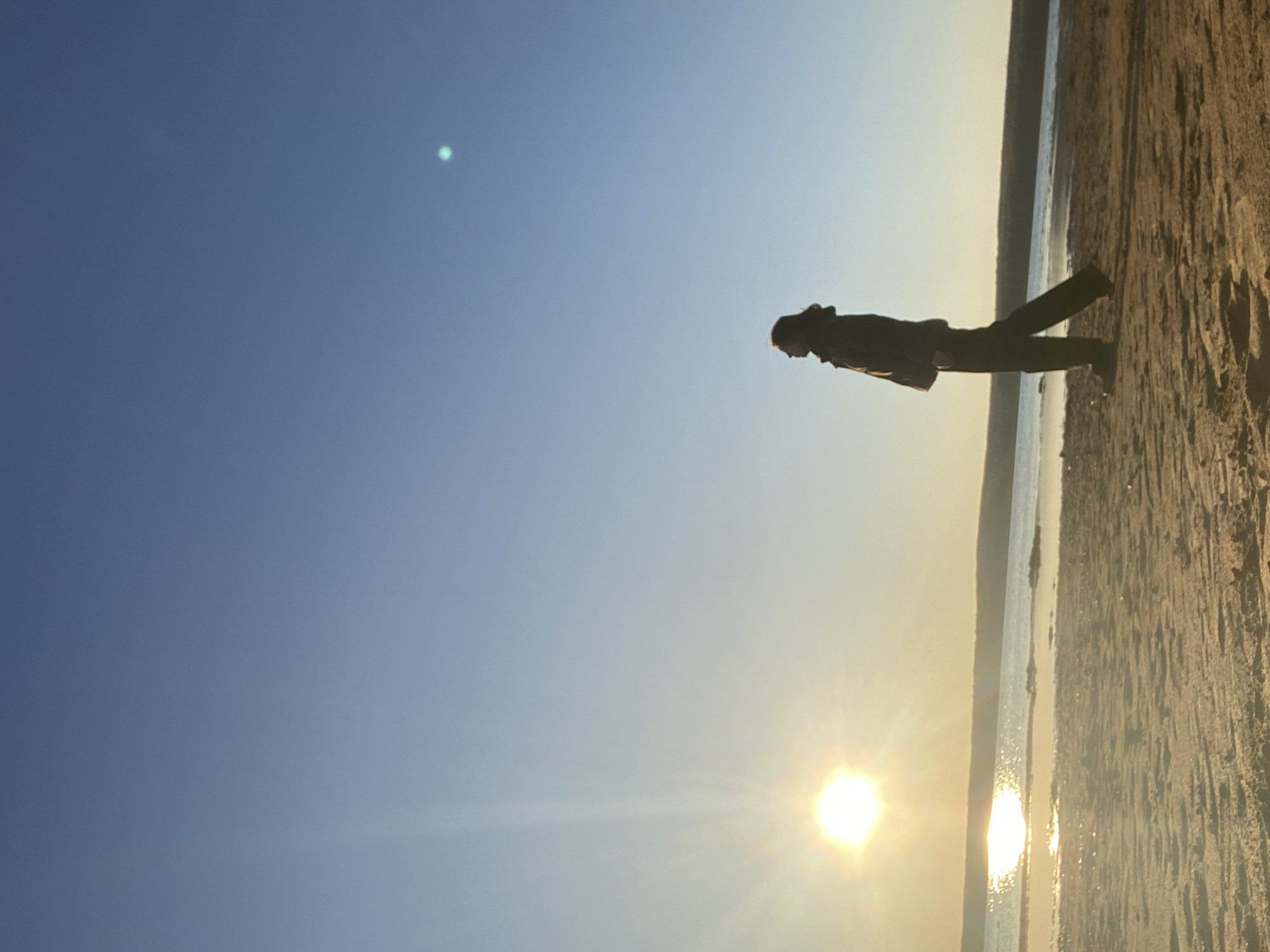 Woman documents sunset beach visit in Chaikovsky, Russia