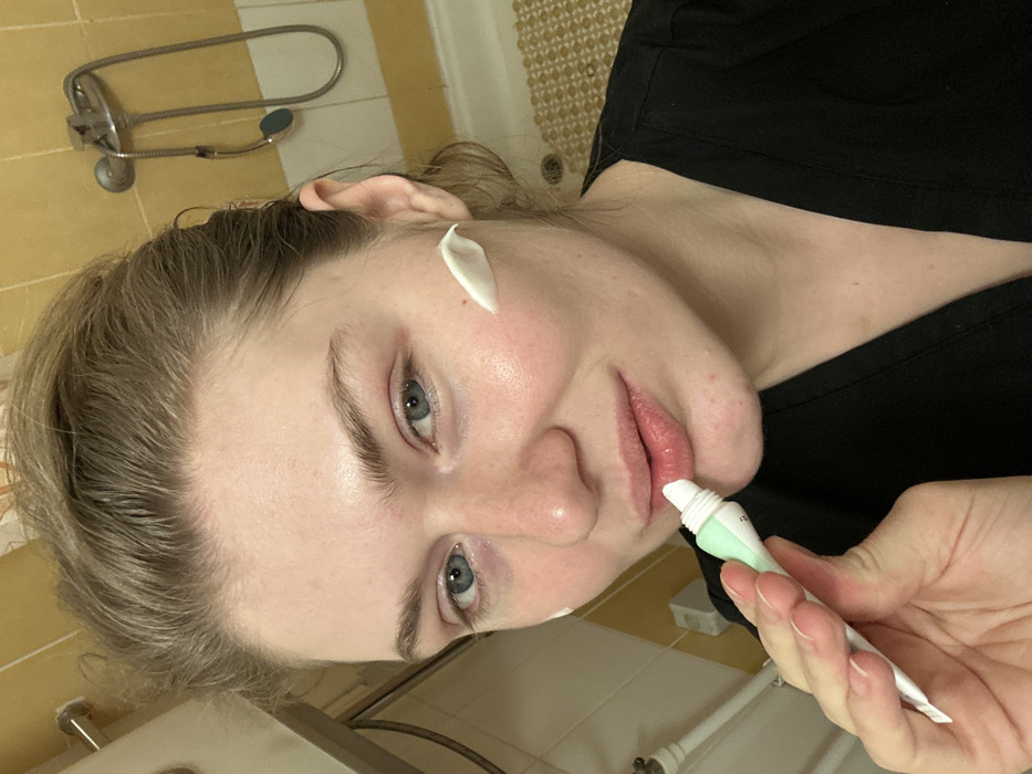 Healthcare worker documents evening skincare routine in Kazan