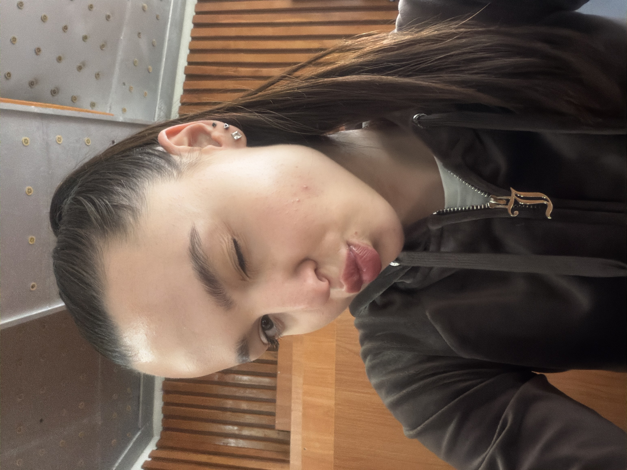 Young woman takes multiple selfies during afternoon in Sofia