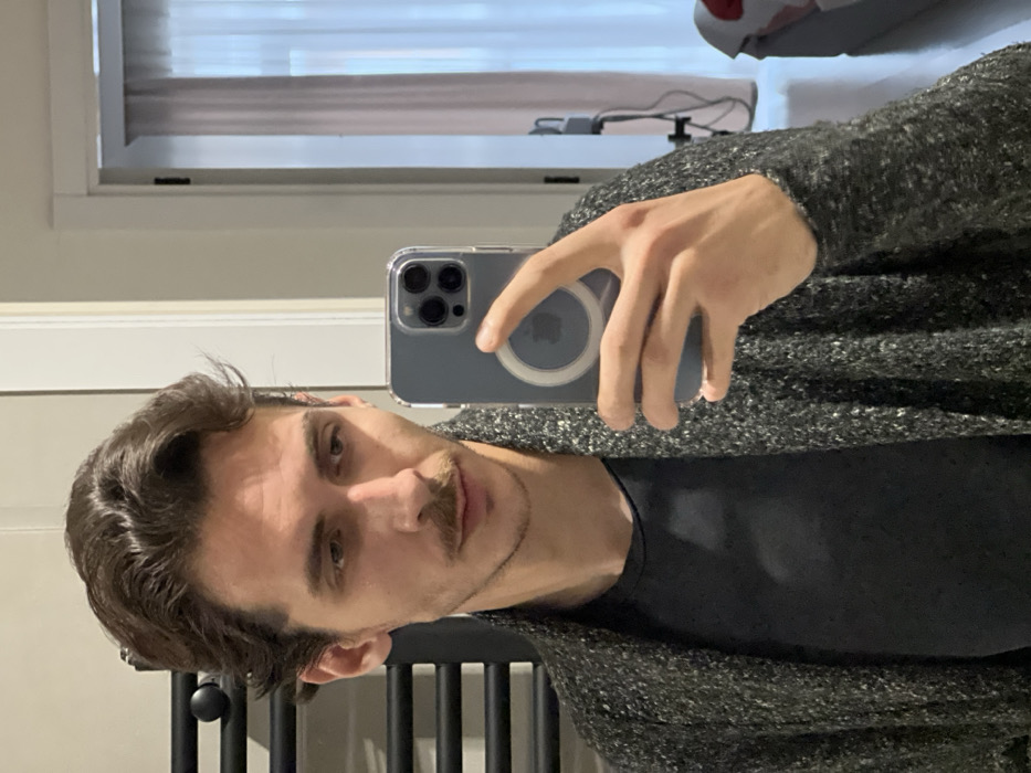 Young Man Takes Multiple Mirror Selfies in Tbilisi Home