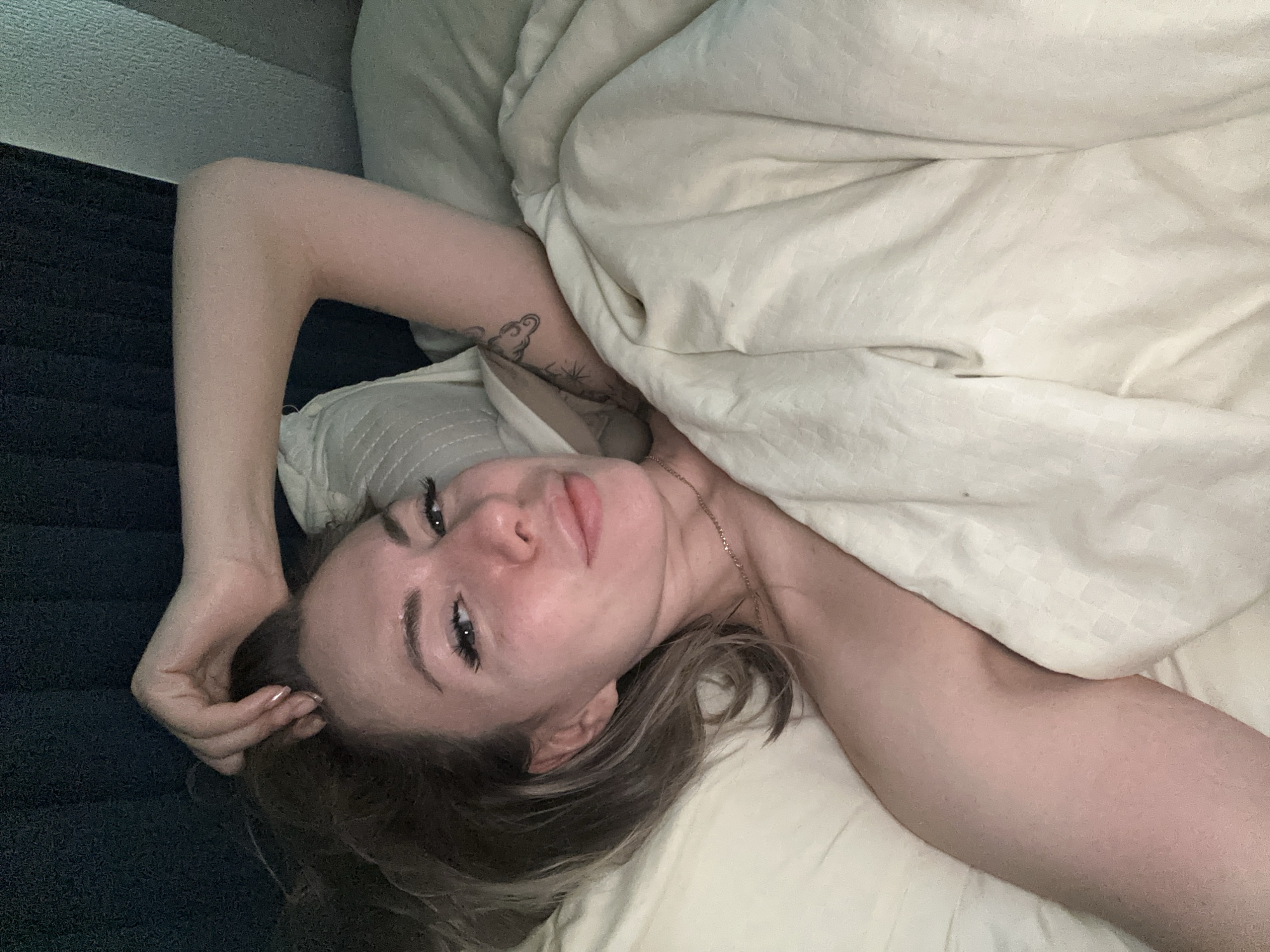 Woman resting in bed captured in early morning Khimki moment