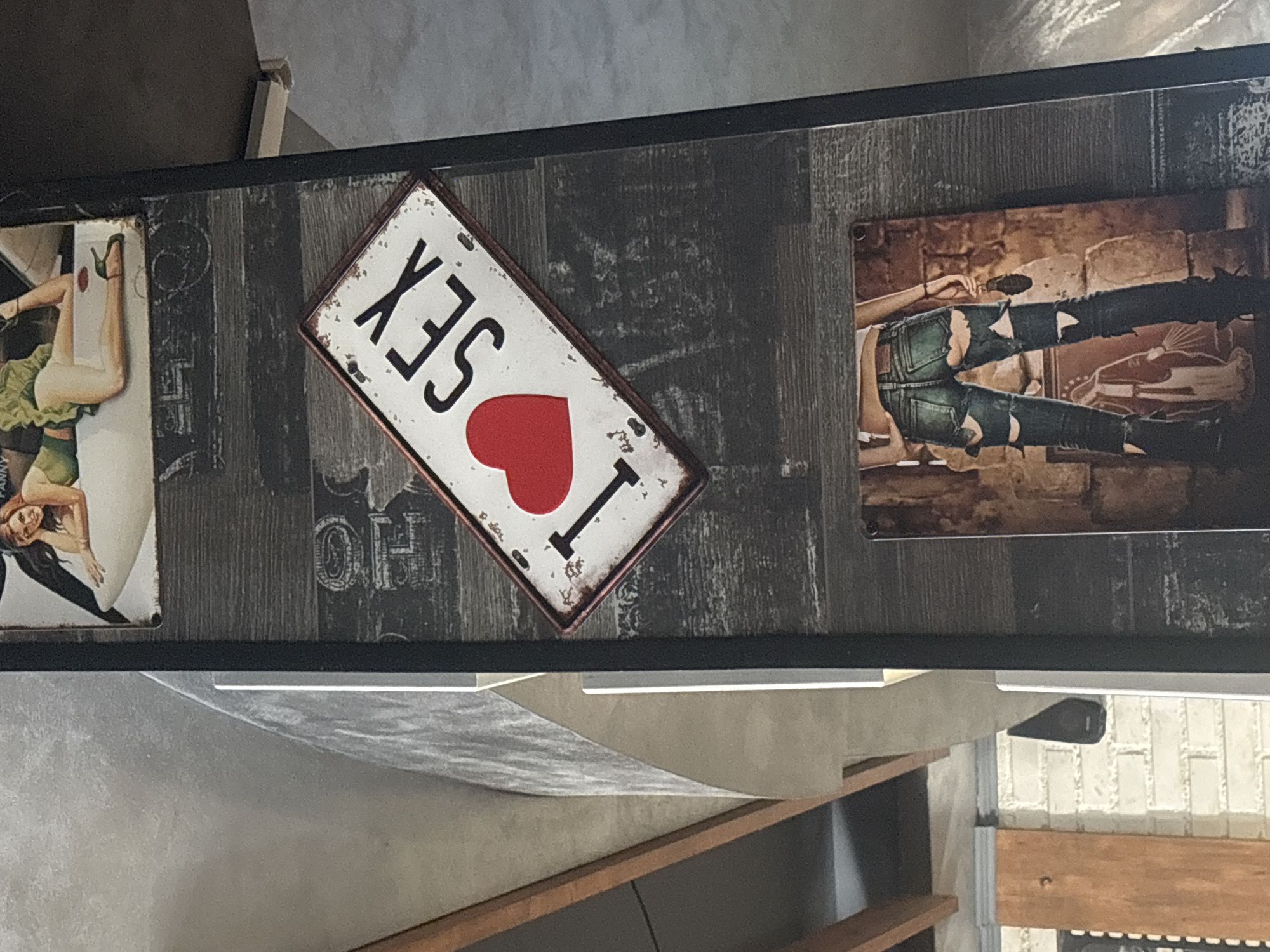 Metal decorative signs displayed on shelf in Bulgarian town
