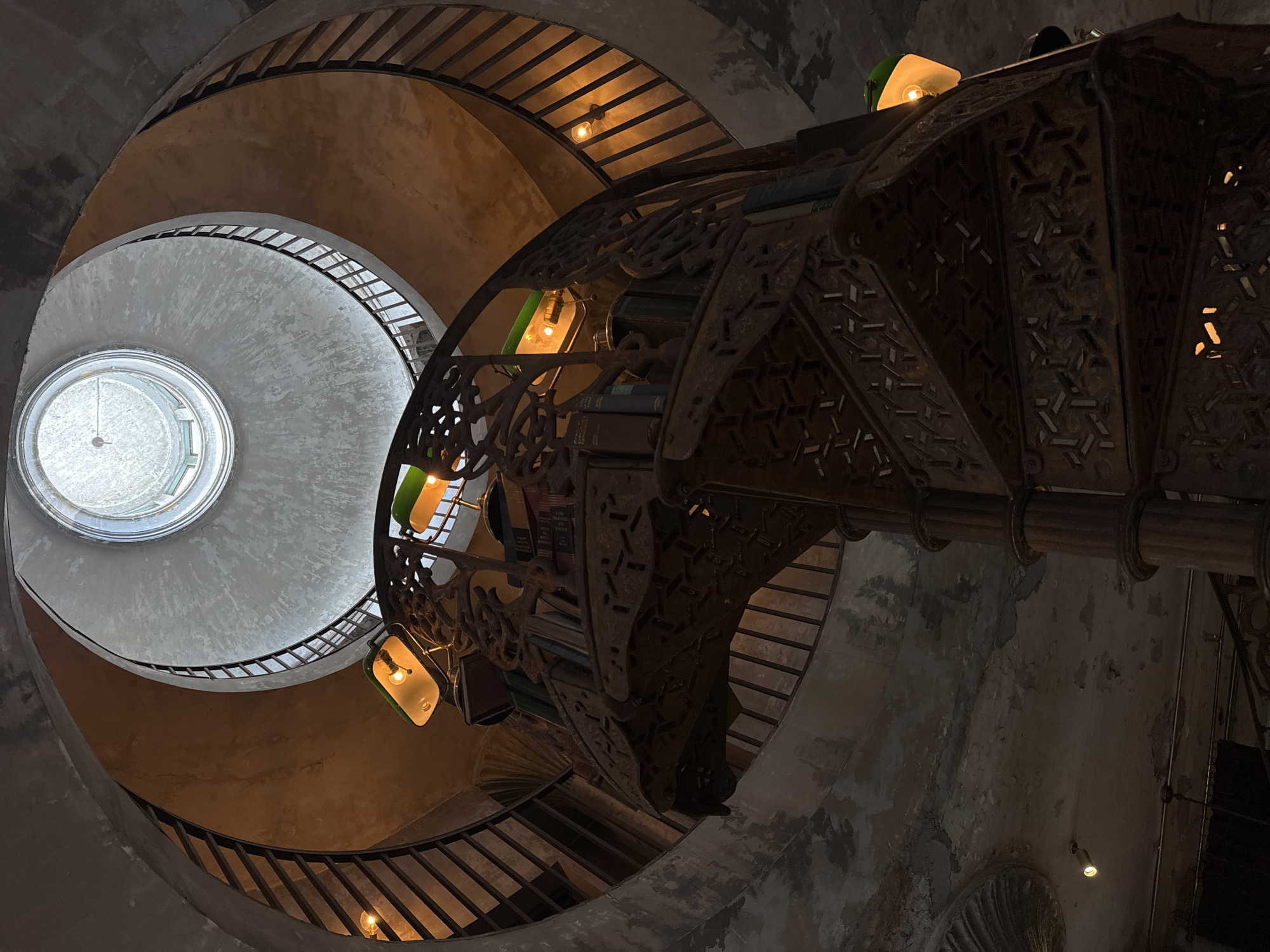 Bangkok bar with taxidermy, spiral stairs, and old-world atmosphere