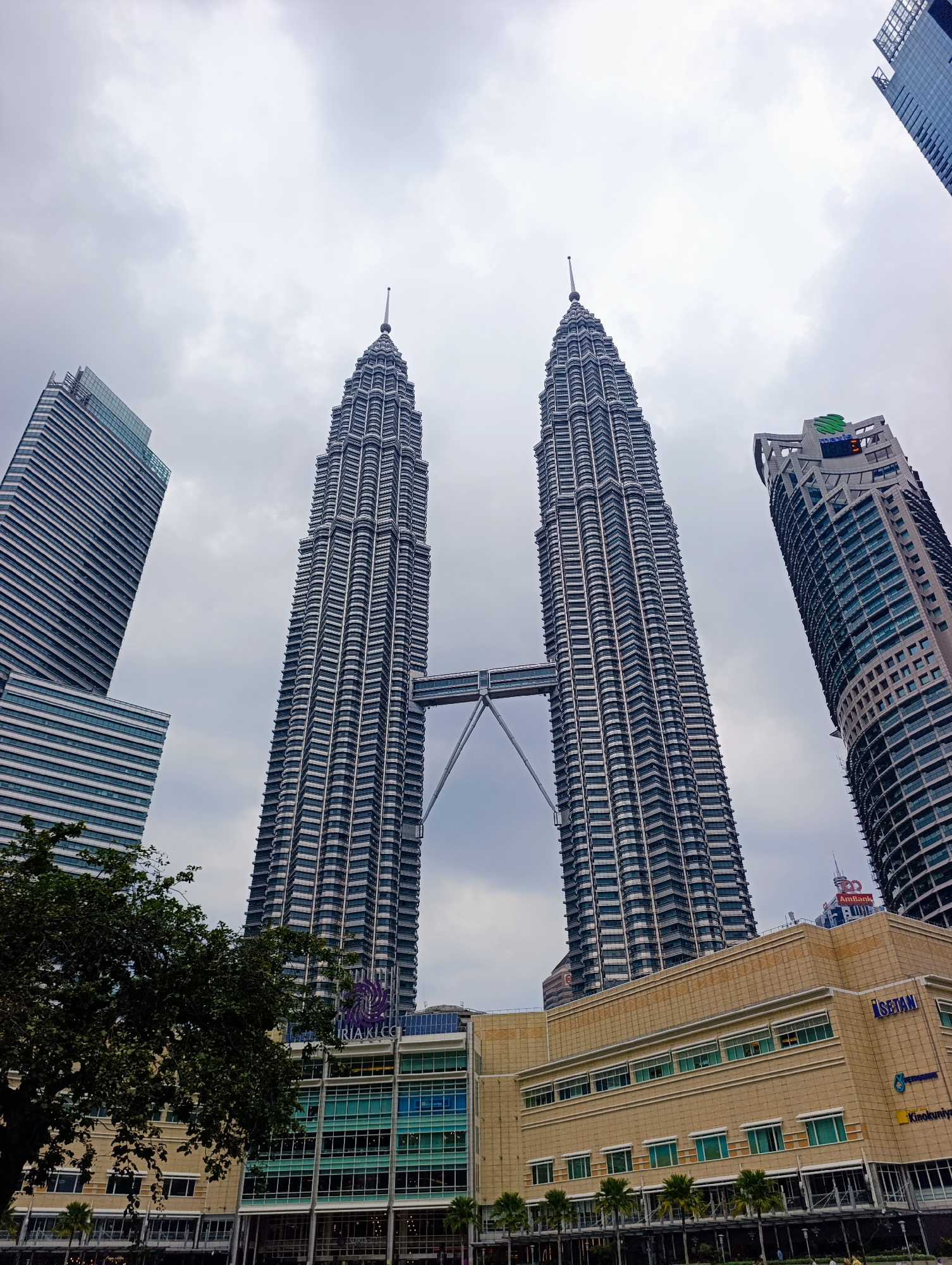 Morning view captured of Petronas Towers under cloudy skies