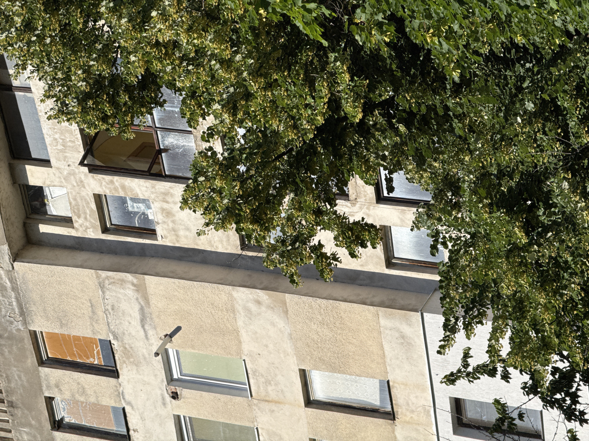 Weathered concrete building facade in Lovech, Bulgaria