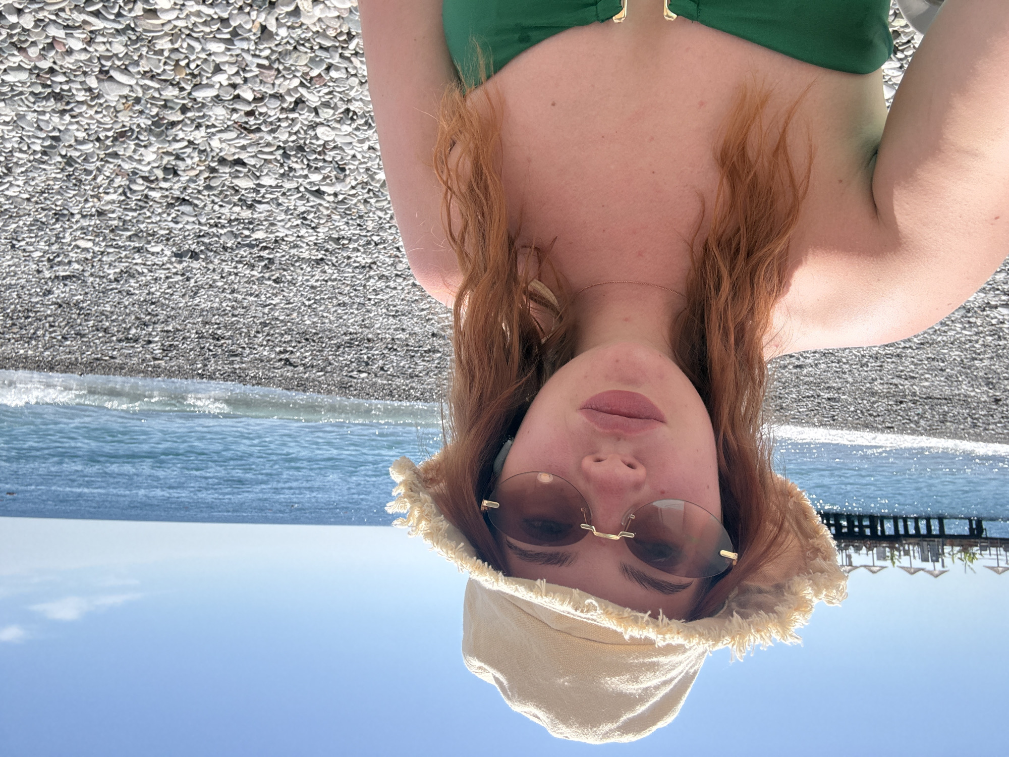 Woman documents beach vacation selfies in Kemer, Turkey