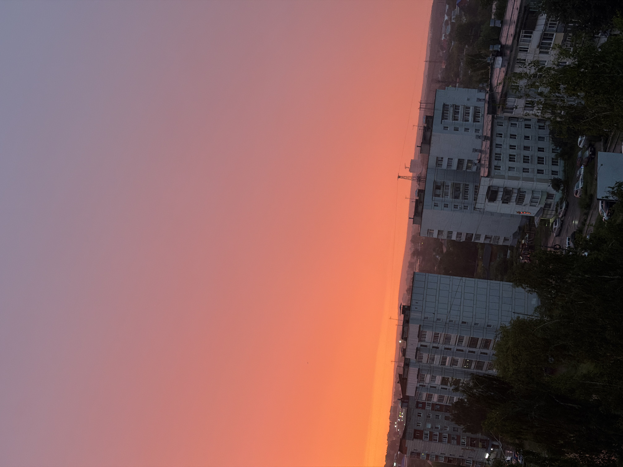 Vivid summer sunset over Chaikovsky's residential skyline