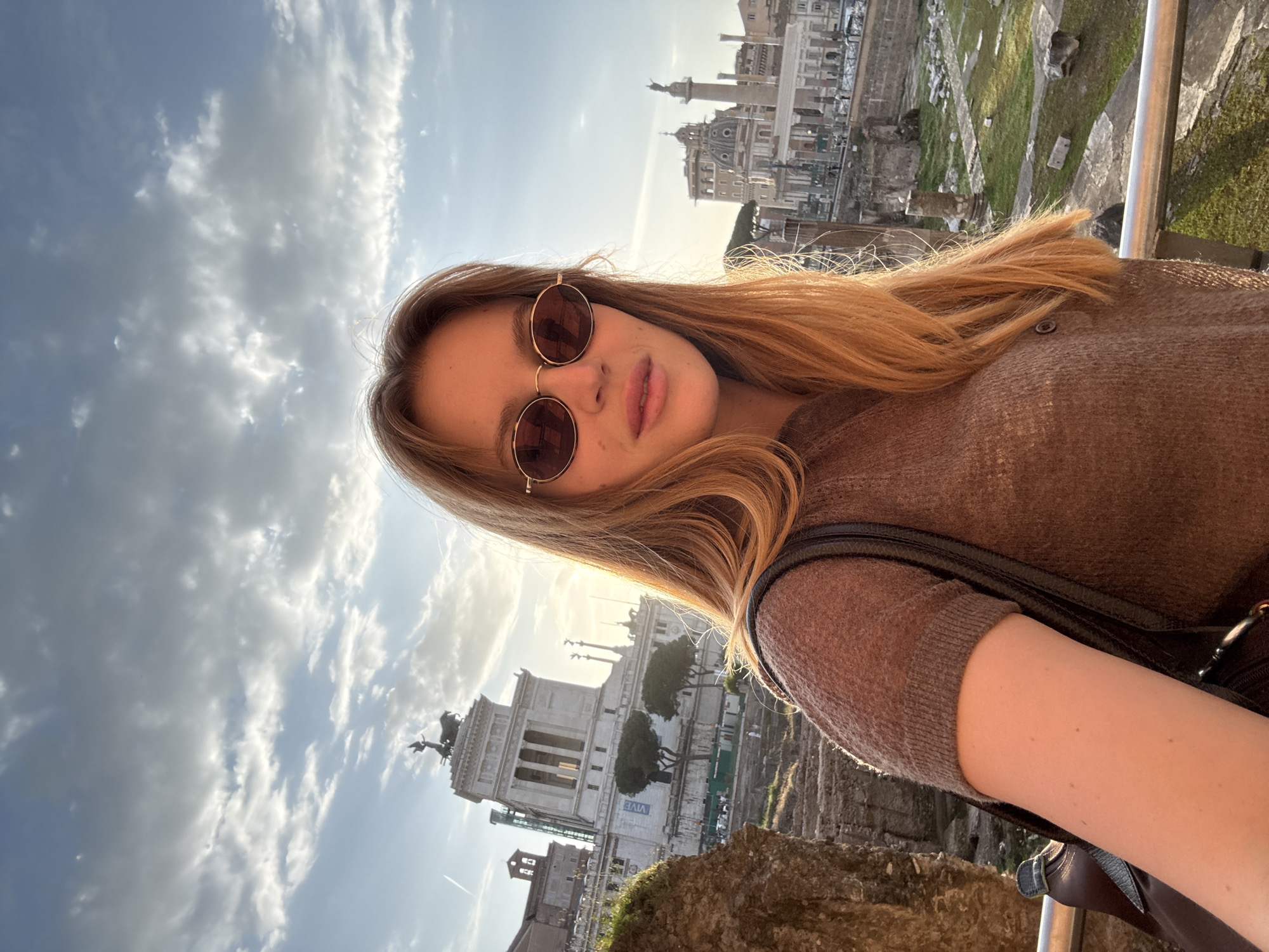 Tourists photograph themselves at Rome's Vittoriano monument Friday afternoon