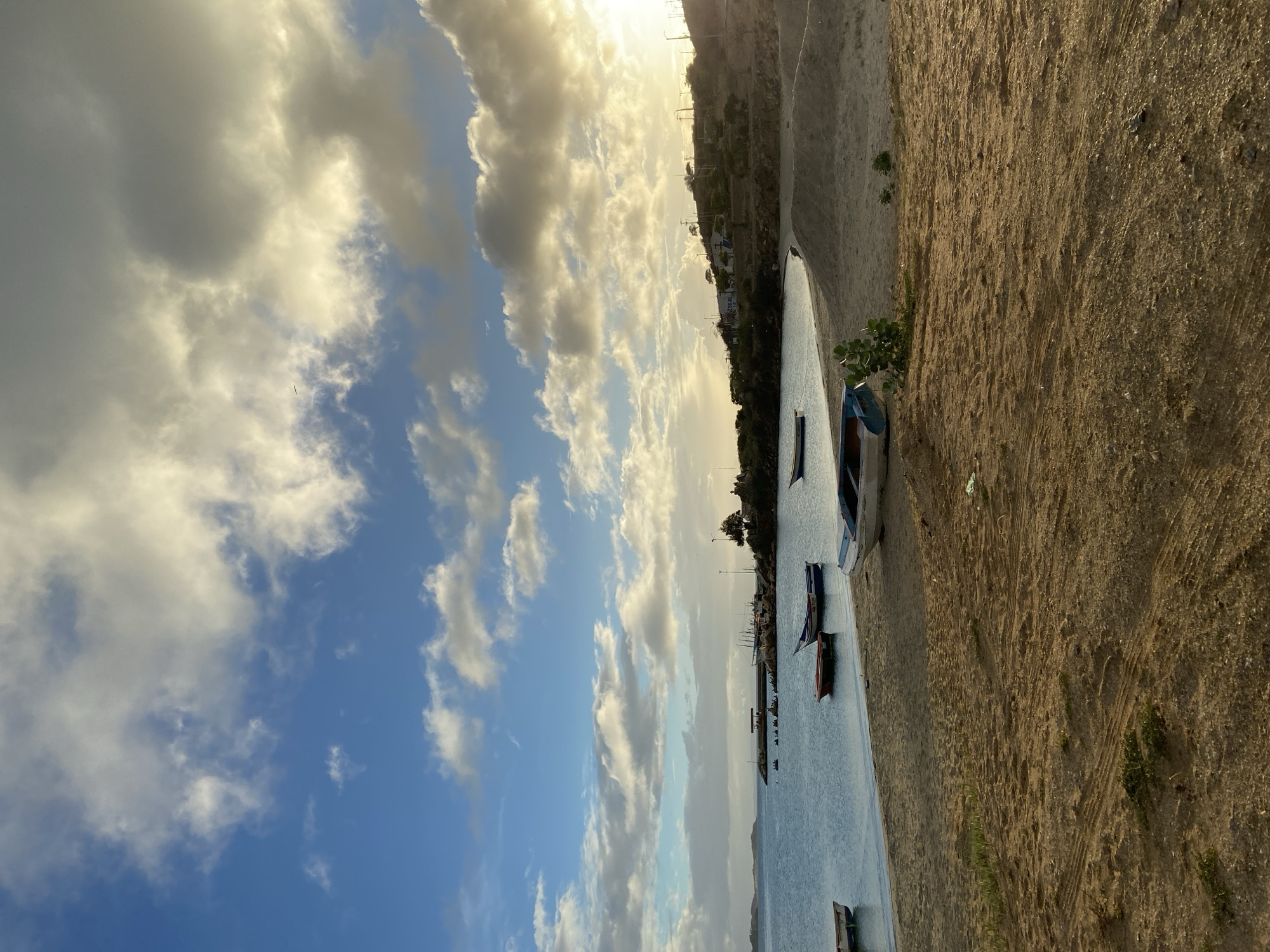 Sunset hour across Juan Griego's bay, beach, and hillsides