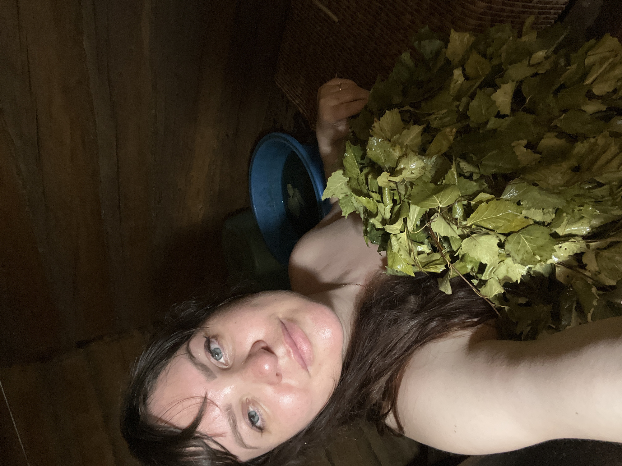 Woman enjoys traditional Russian banya treatment in Panteleevka sauna