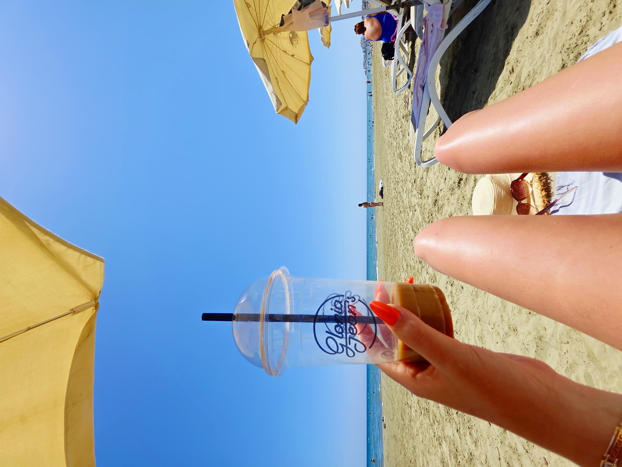 Relaxed beach morning in Larnaca with iced coffee in hand