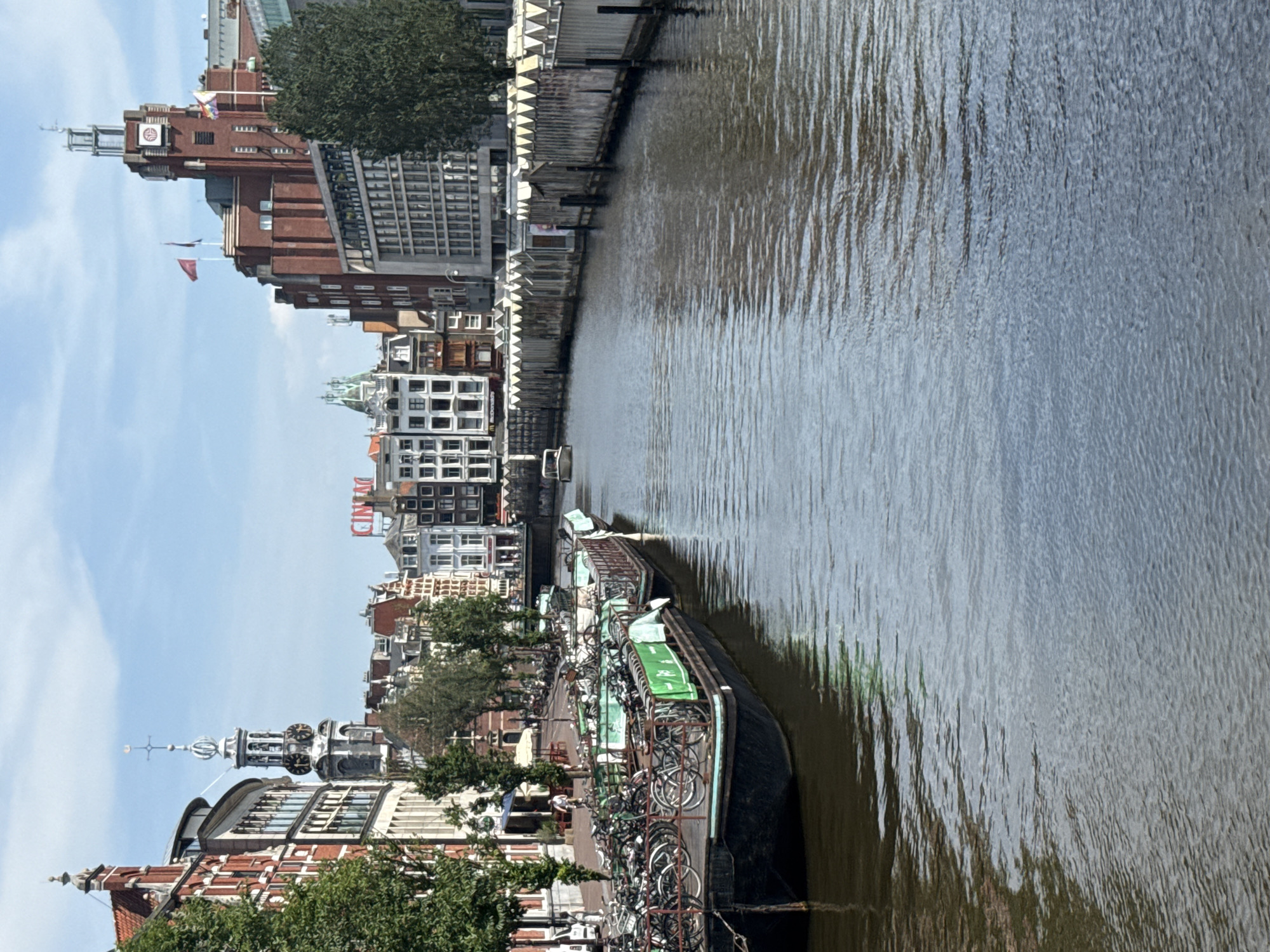 Amsterdam streets and canals during Pride, sunny June afternoon