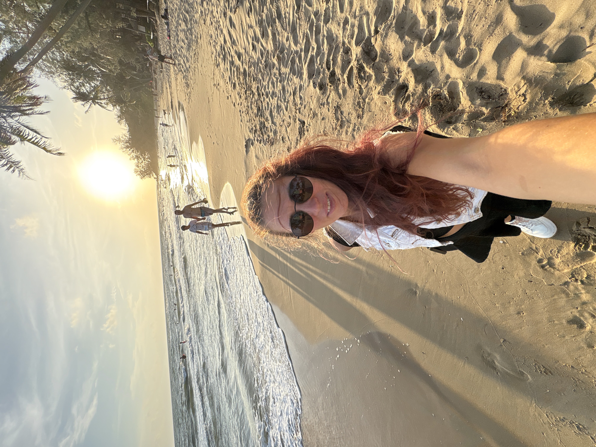 Sunset beach selfies, palm trees, and yoga by the shore