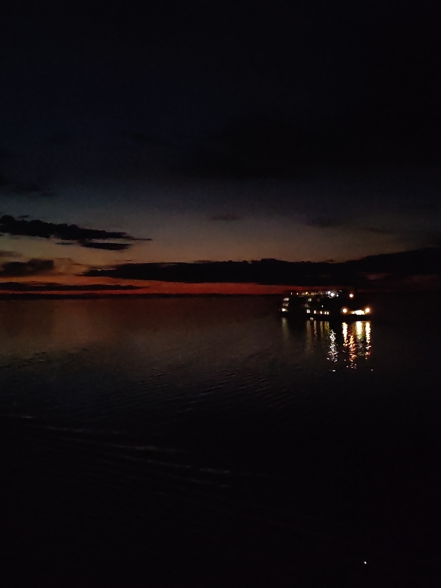 Tourist boat spotted at night over submerged Russian town