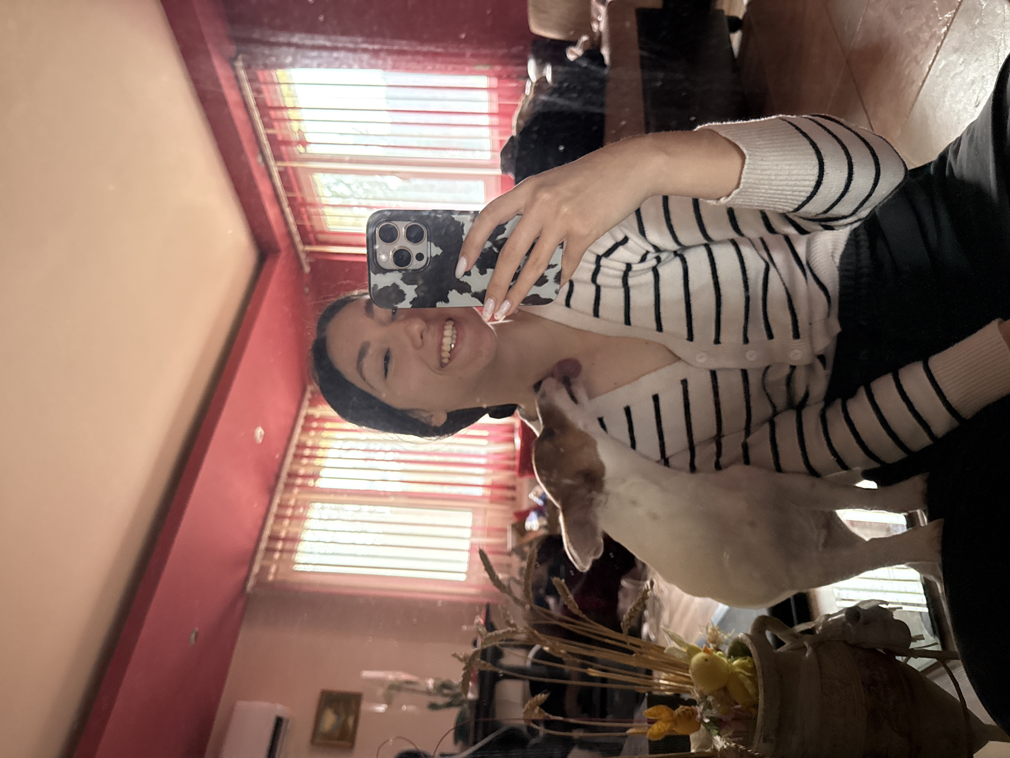 Woman takes mirror selfie with dog in Bulgaria